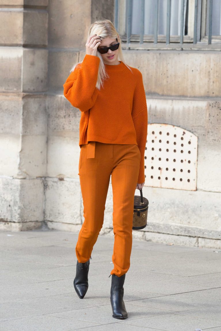 Devon Windsor in an Orange Trousers