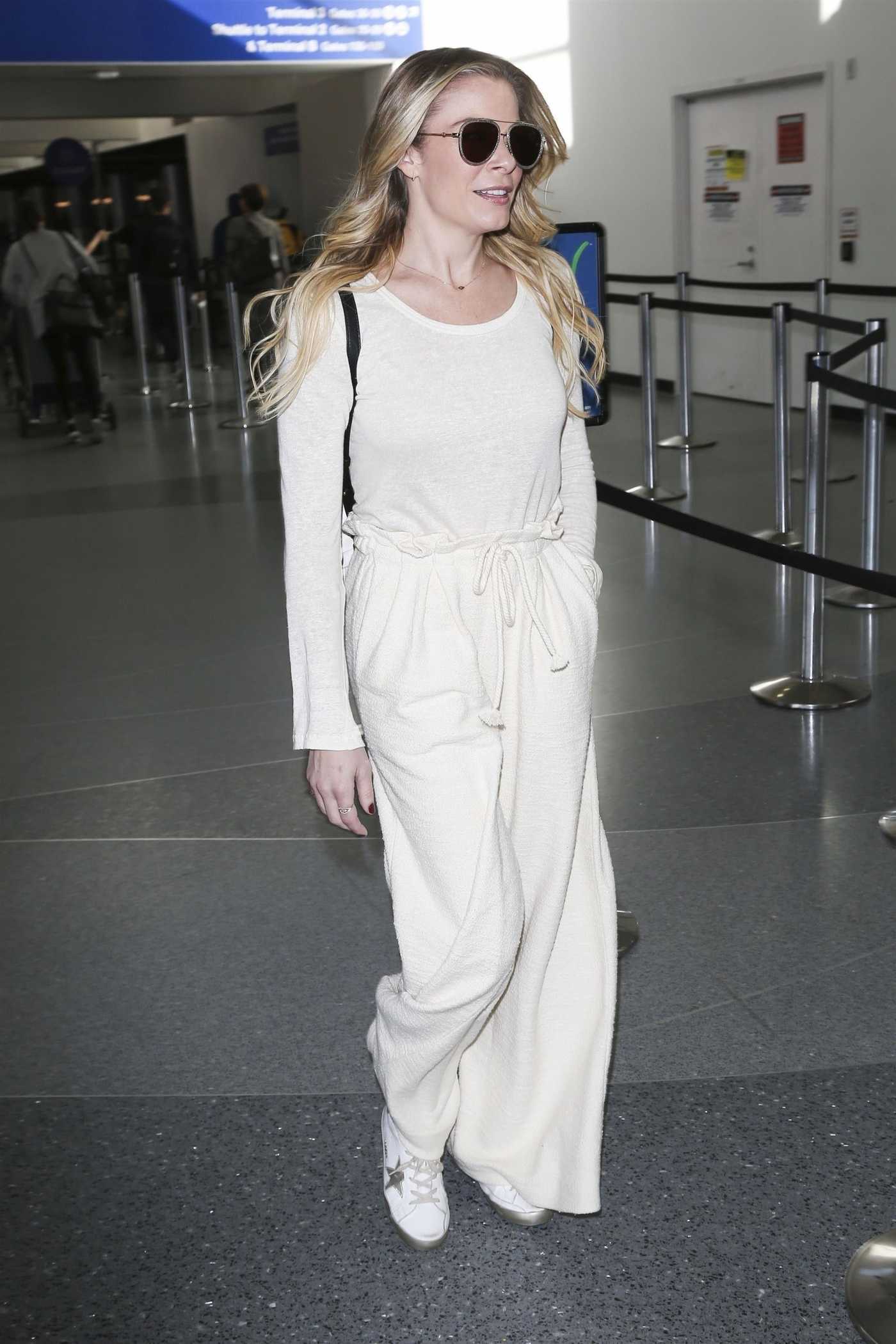 LeAnn Rimes in a White Sweatpants Arrives at LAX Airport in LA 12/26/2018