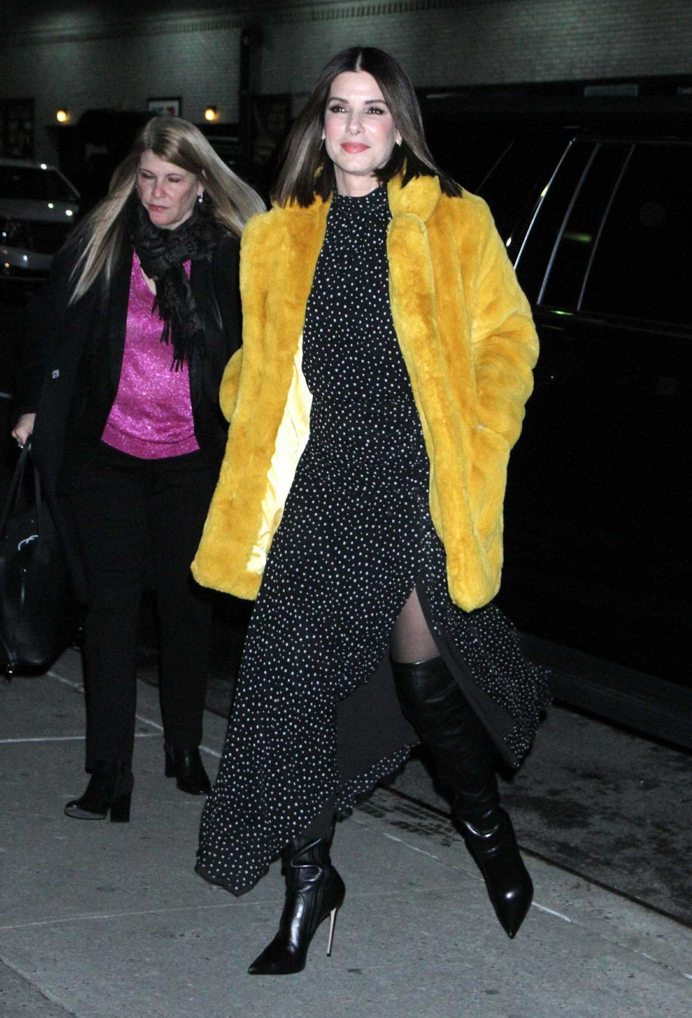 Sandra Bullock in a Yellow Fur Coat Arrives on The Late Show with Stephen Colbert in New York 12/17/2018