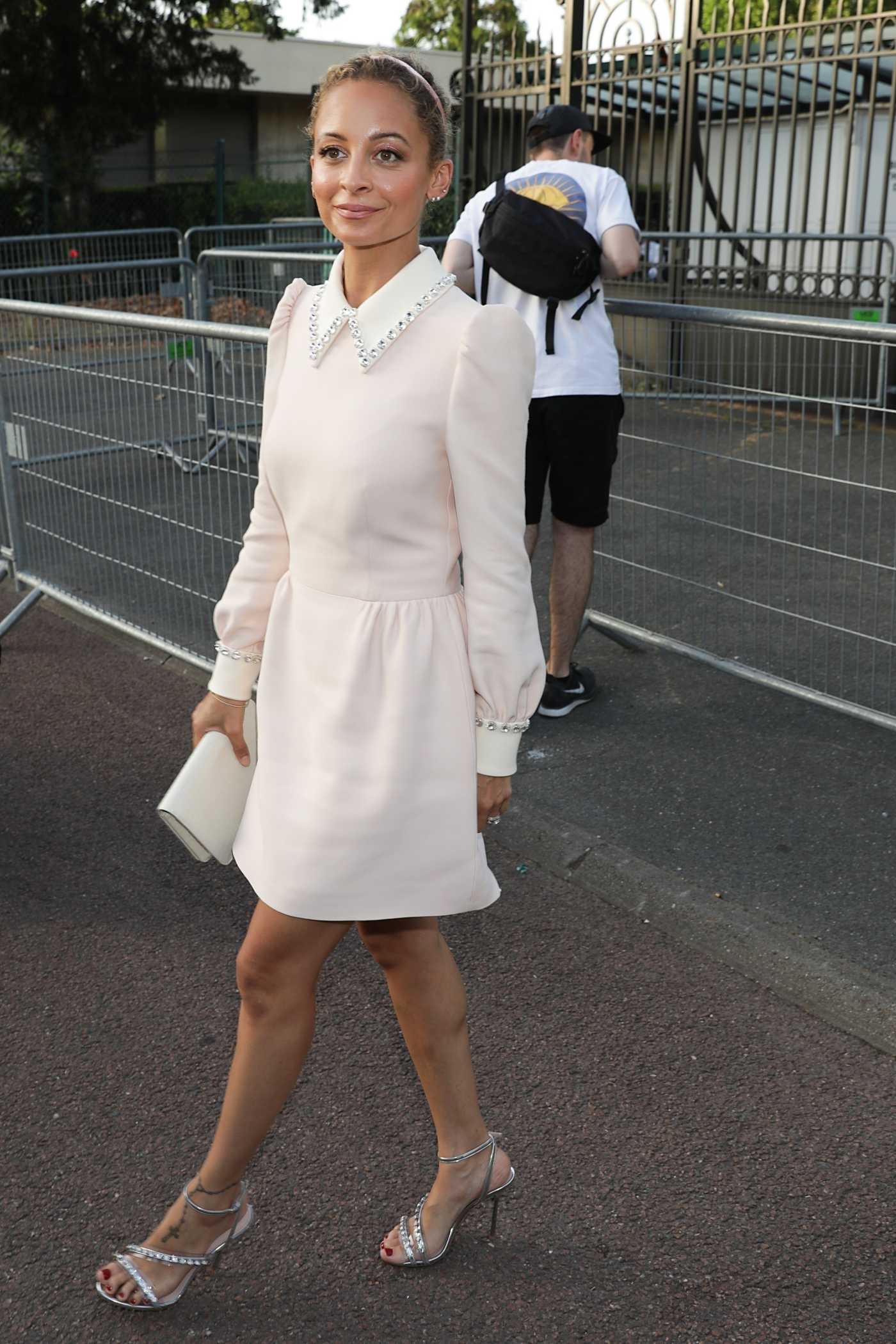 Nicole Richie in a White Dress Arrives at the Miu Miu Club Event in Paris 06/29/2019