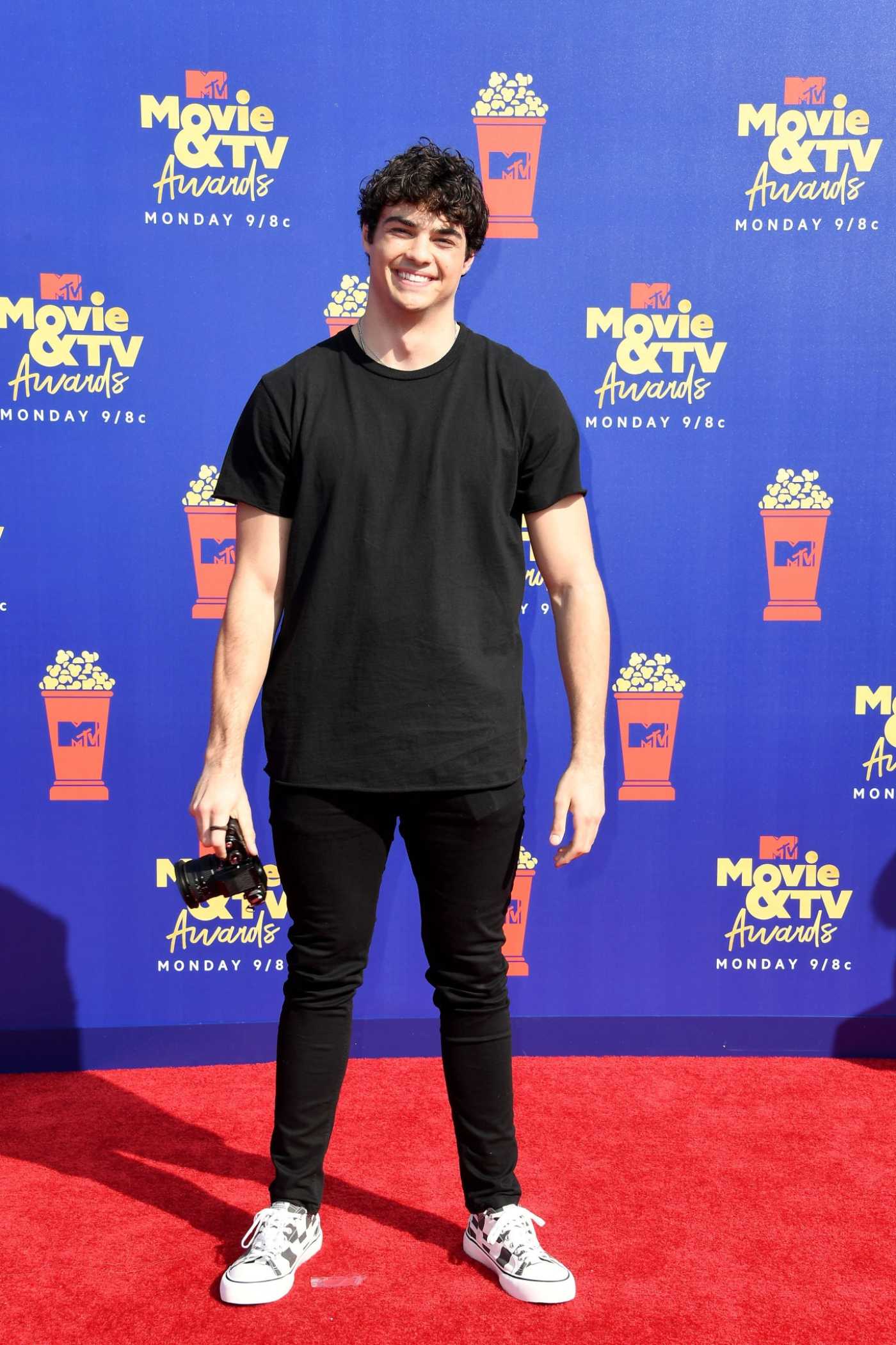 Noah Centineo Attends 2019 MTV Movie and TV Awards at Barker Hangar in Santa Monica 06/15/2019