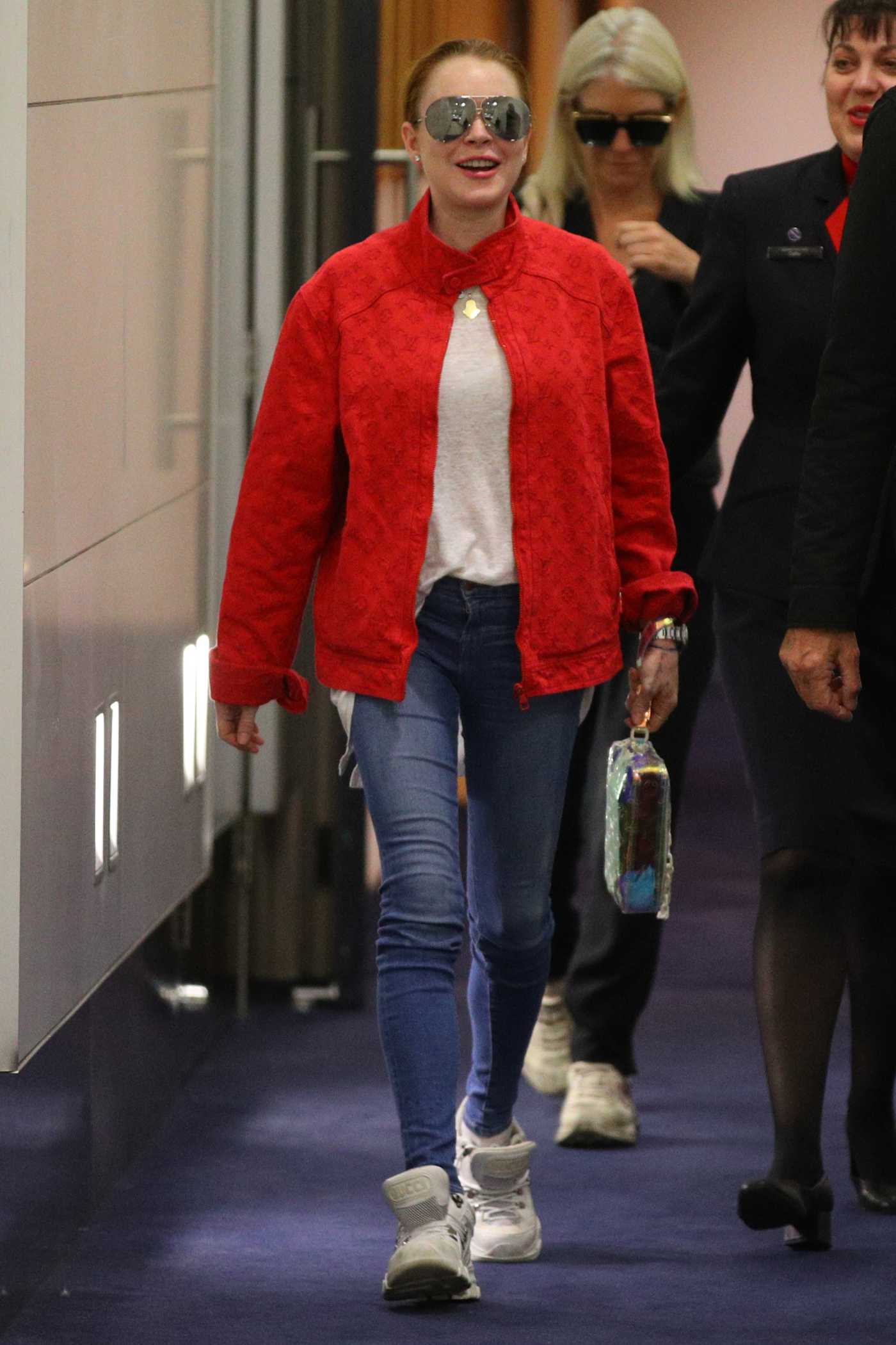 Lindsay Lohan in a Red Jacket Arrives at JA Douglas McCurdy Airport in Sydney 07/17/2019