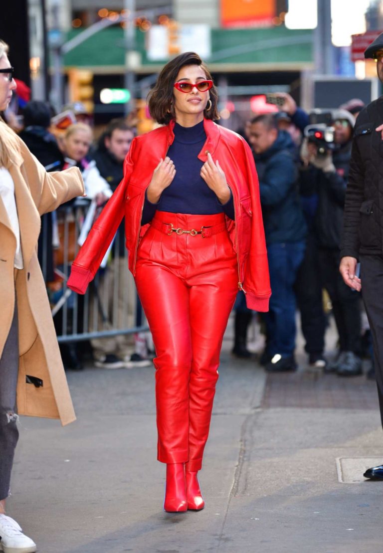 Naomi Scott in a Red Suit