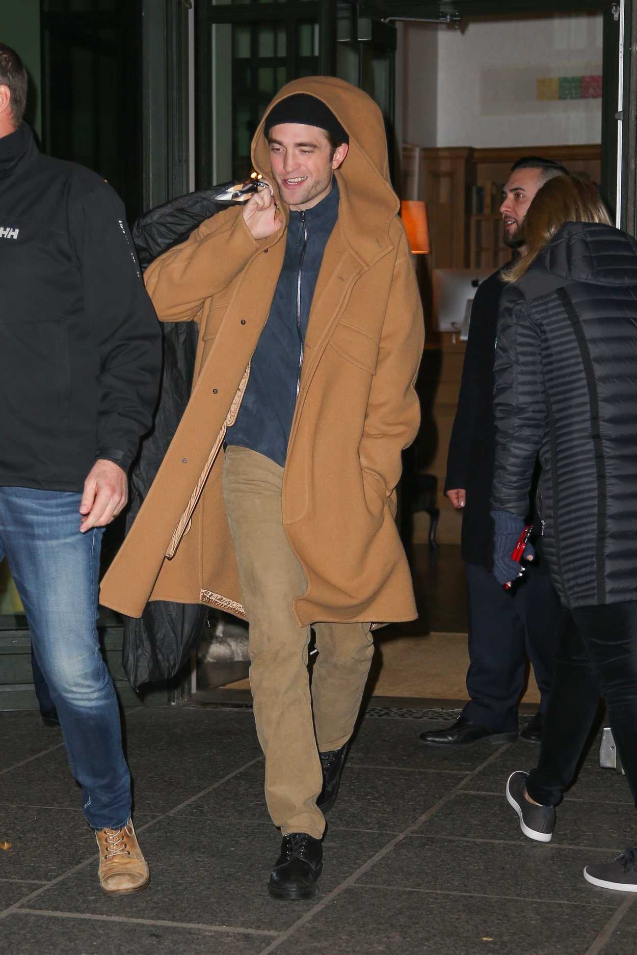 Robert Pattinson in a Beige Coat Leaves His Hotel in New York City 11/19/2019