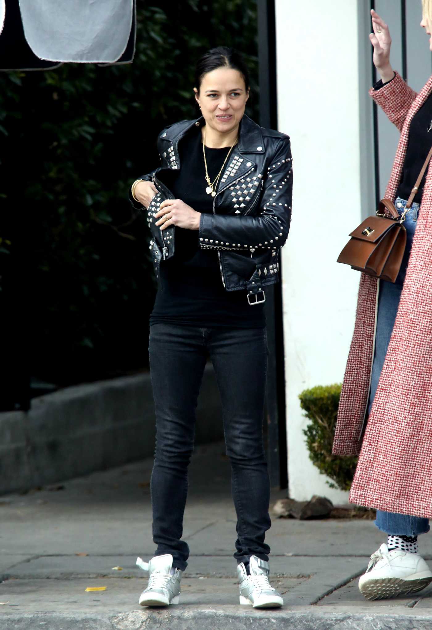 Michelle Rodriguez in a Black Leather Jacket Heads Out to Lunch at Gracias Madre in West Hollywood 12/18/2019