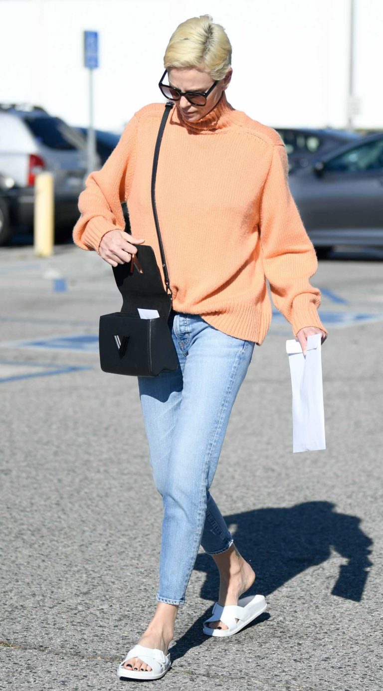 Charlize Theron in an Orange Sweater