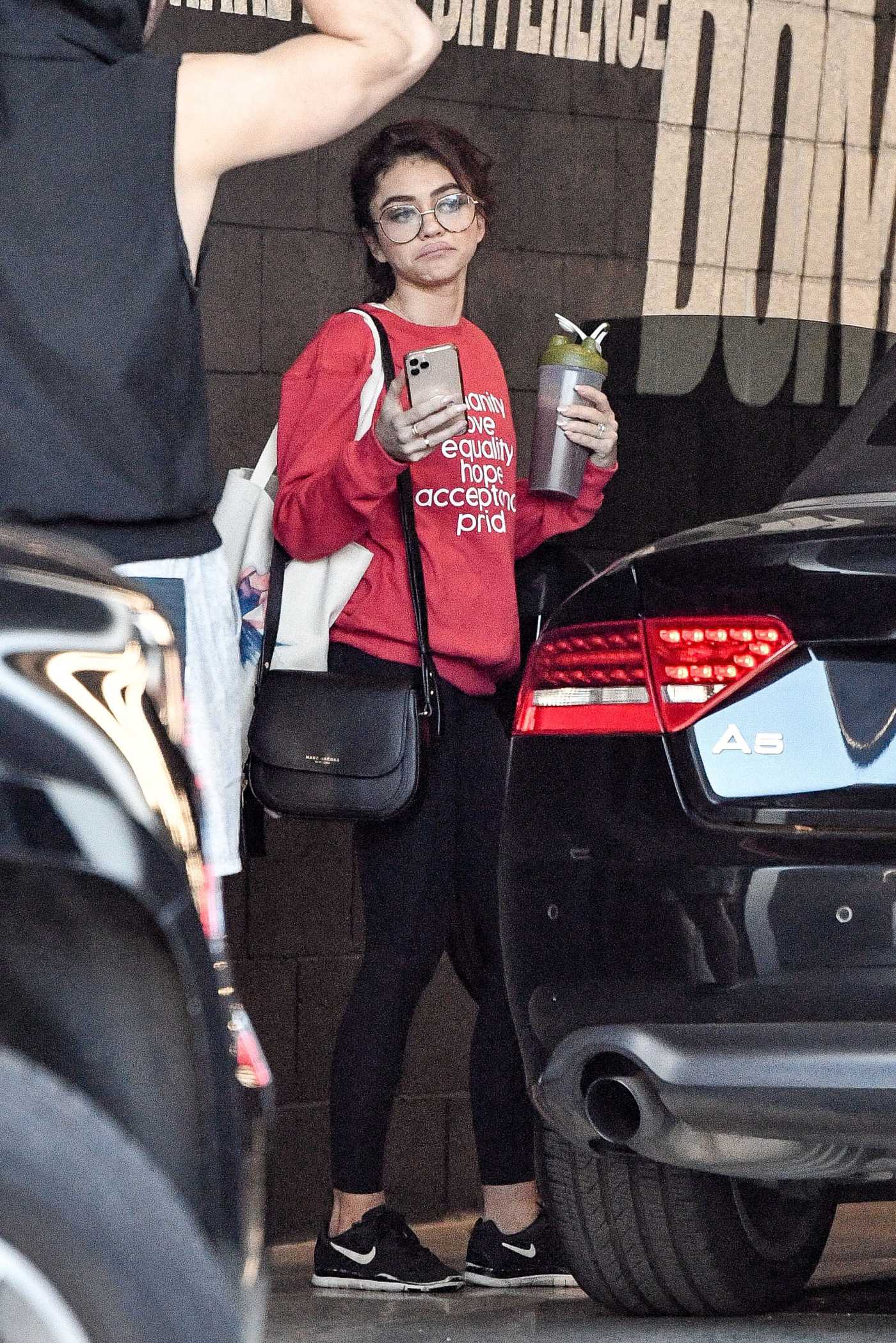 Sarah Hyland in a Red Sweatshirt Leaves the Dogpoung Gym in West Hollywood 02/14/2020