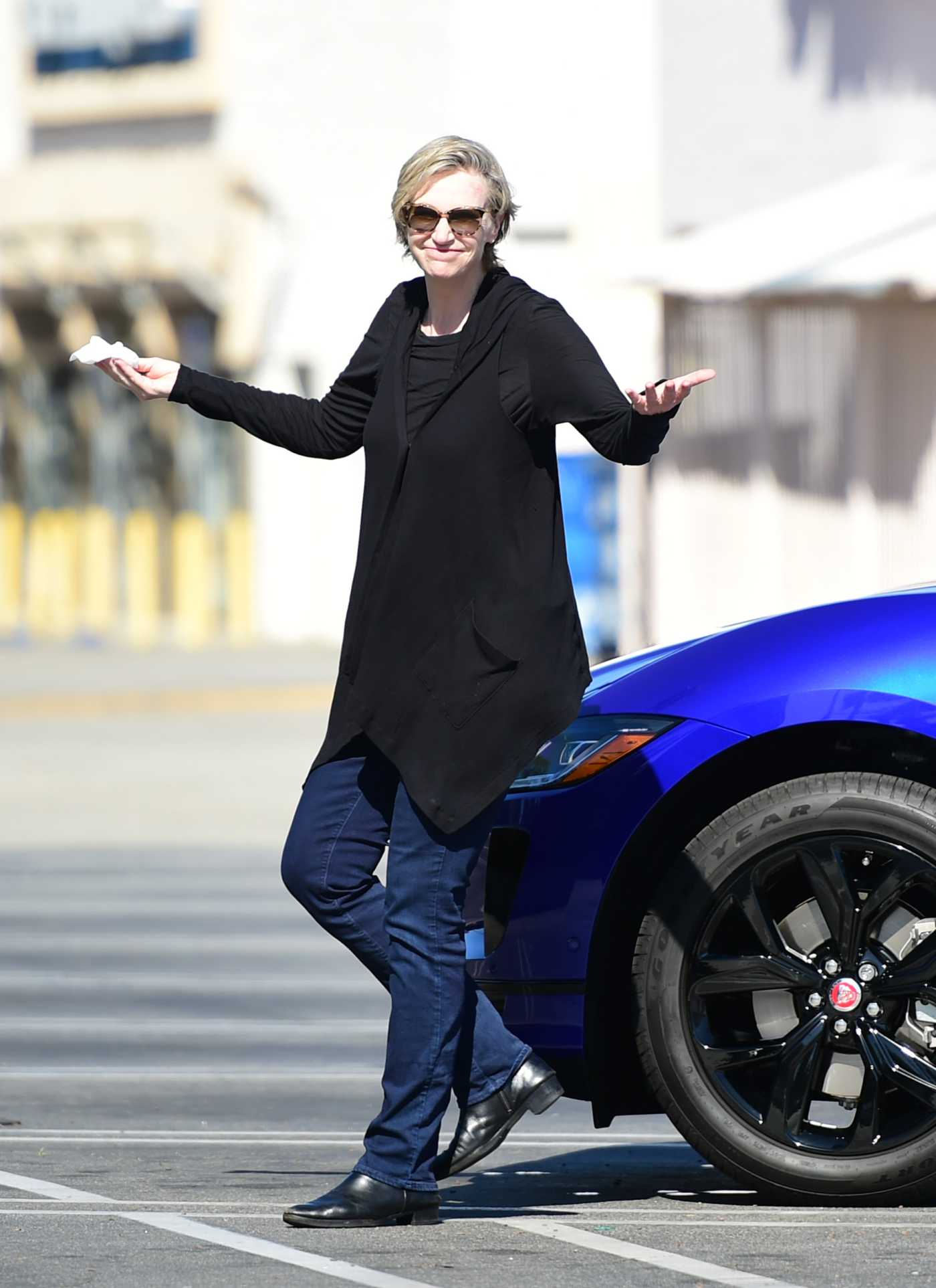 Jane Lynch Wipes Down Her Brand New Jaguar During the COVID-19 Lockdown in Los Angeles 04/25/2020