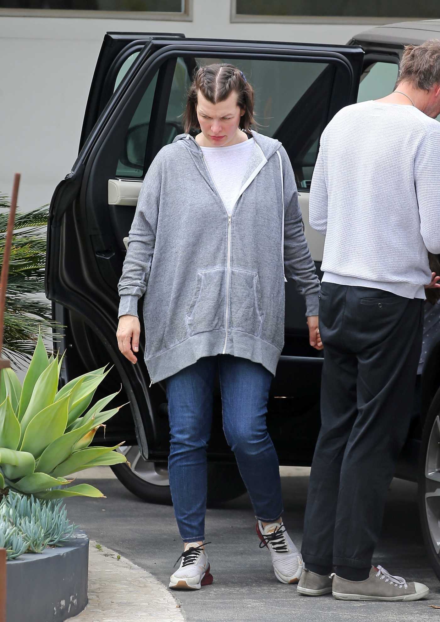 Milla Jovovich in a Gray Hoody Arrives at a Friends House in Los Angeles 05/12/2020