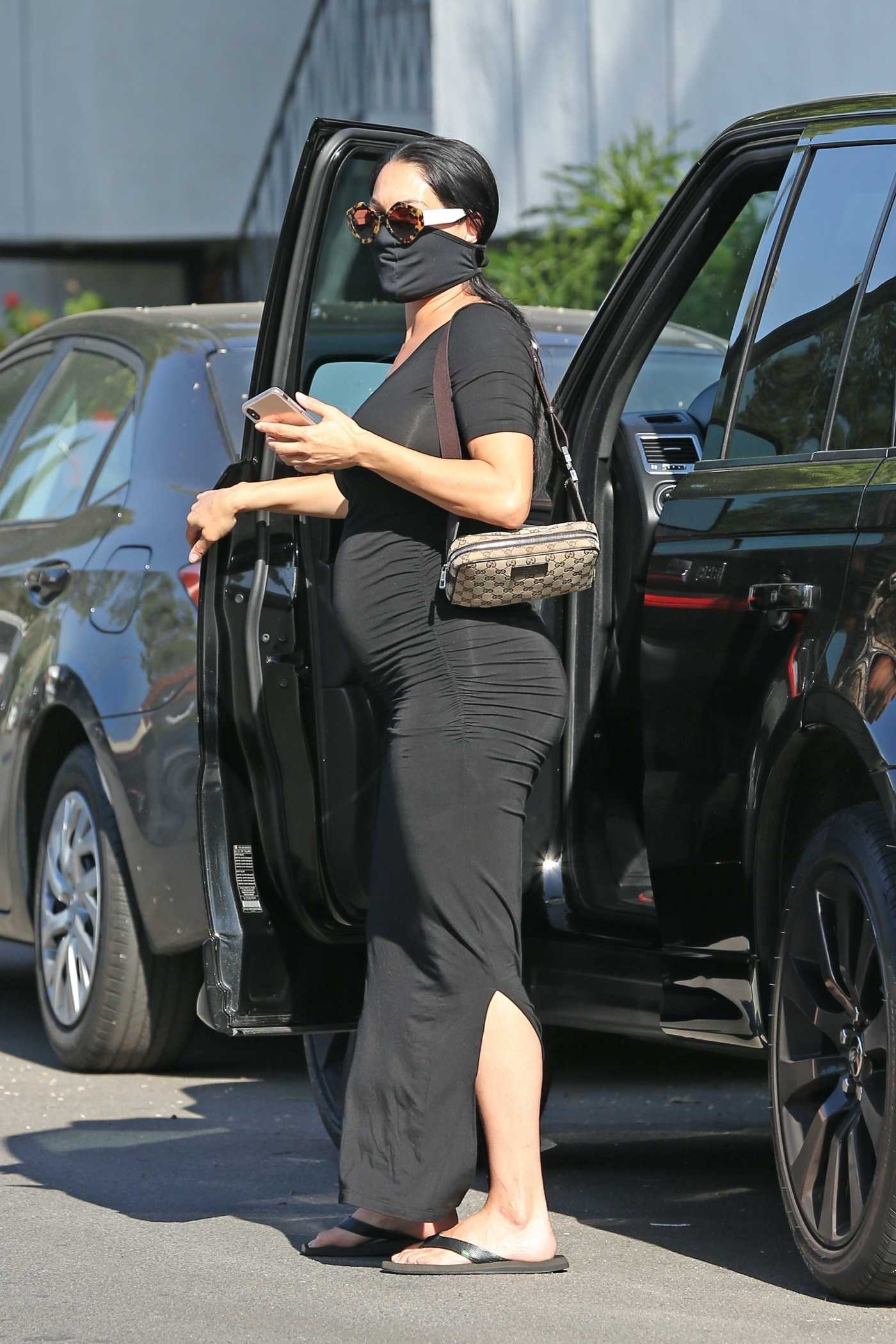 Nikki Bella in a Black Dress Pumps Gas at Her Local 76 Gas Station in Studio City 05/02/2020