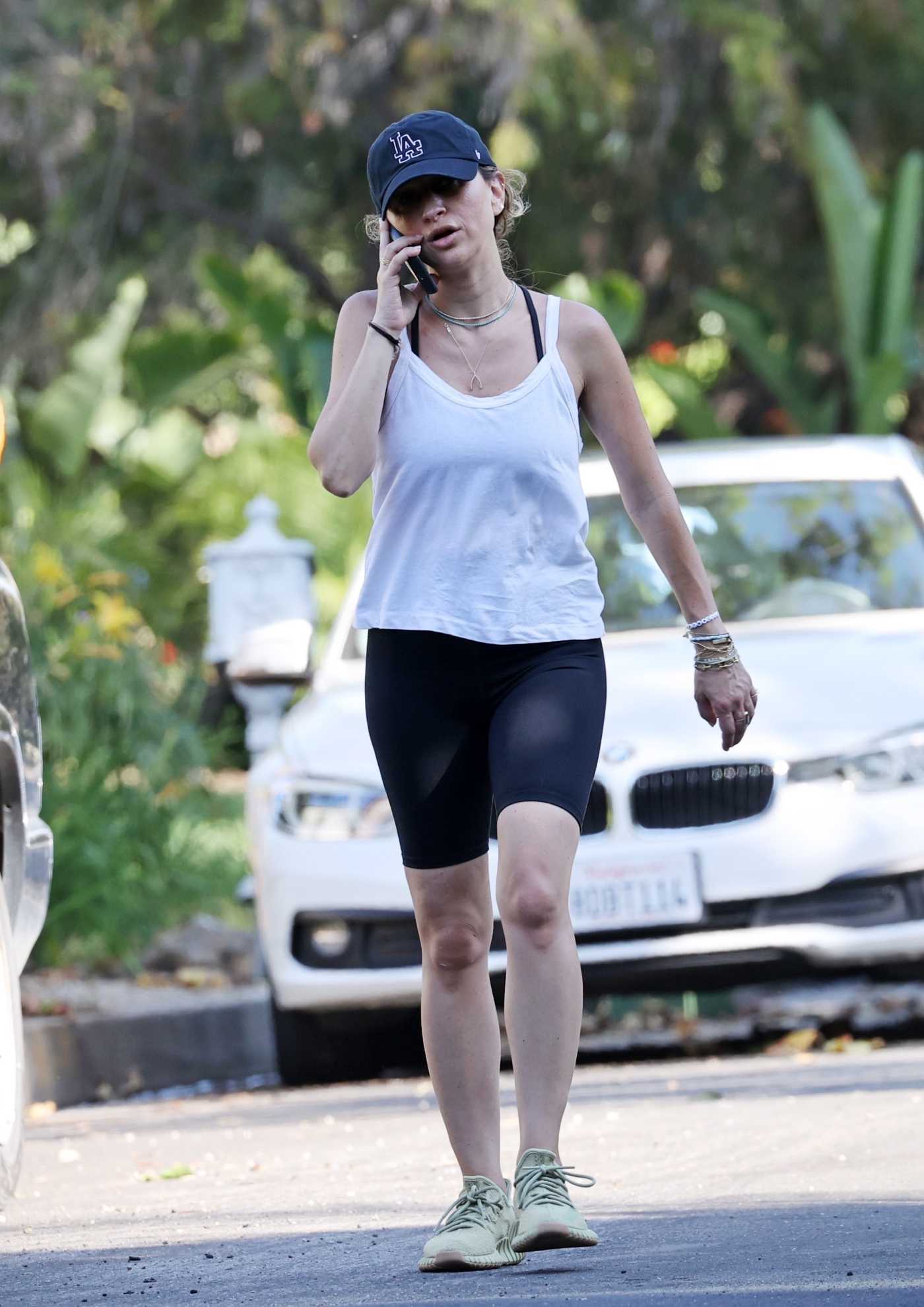 Jennifer Meyer in a White Tank Top Chats on Her Phone while Out for an Evening Walk in Pacific Palisades 06/03/2020