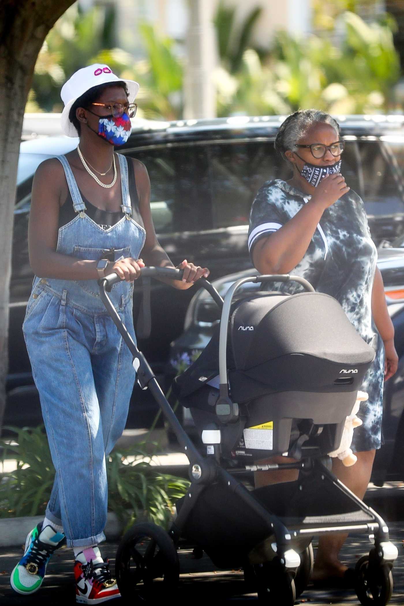 Jodie Turner-Smith in a Denim Jumpsuit Goes Shopping Out with Her Mom and Newborn Baby Girl at Whole Foods in Los Angeles 06/10/2020