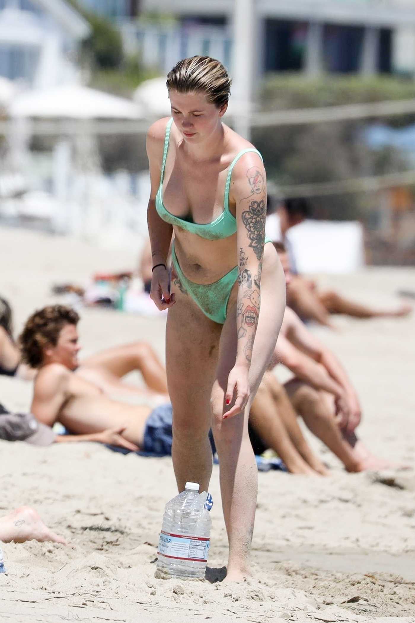 Ireland Baldwin in a Green Bikini on the Beach in Malibu 07/11/2020