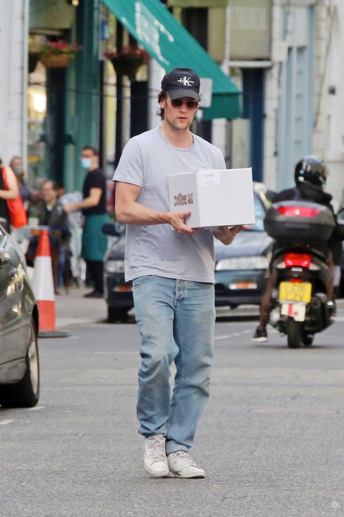 Matt Smith in a Black Cap Picks up a Takeaway Out with a Mystery Blonde in North London 07/24/2020