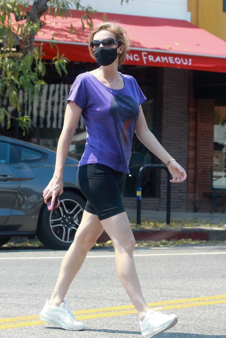 Charlotte Kirk in a Purple Tee