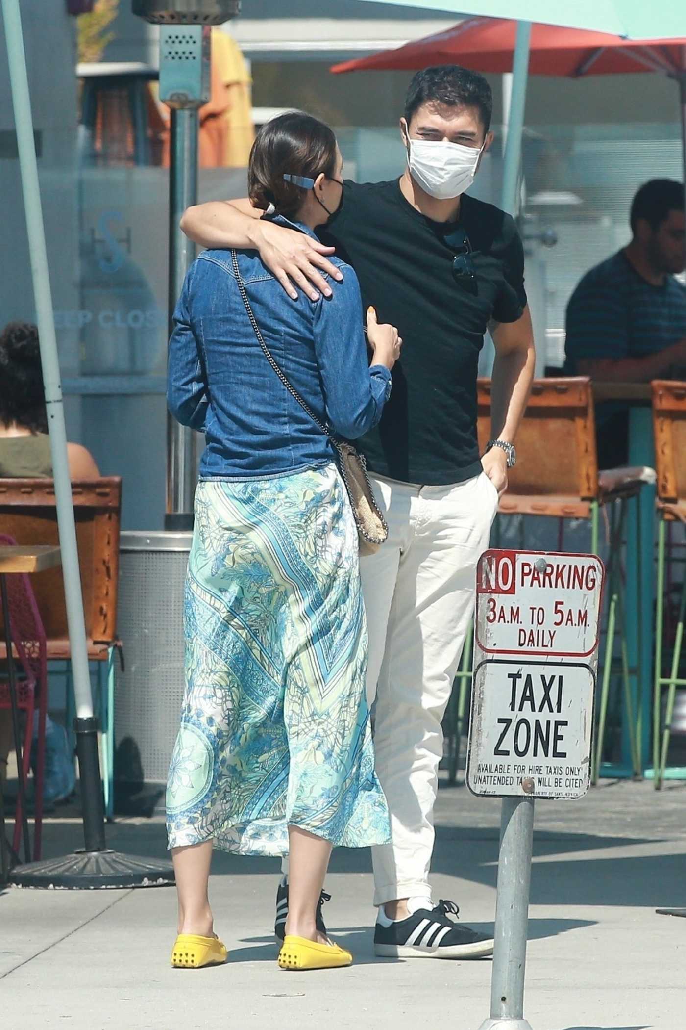 Henry Golding in a White Pants Was Seen Out with His Wife Liv Lo in Santa Monica 08/27/2020