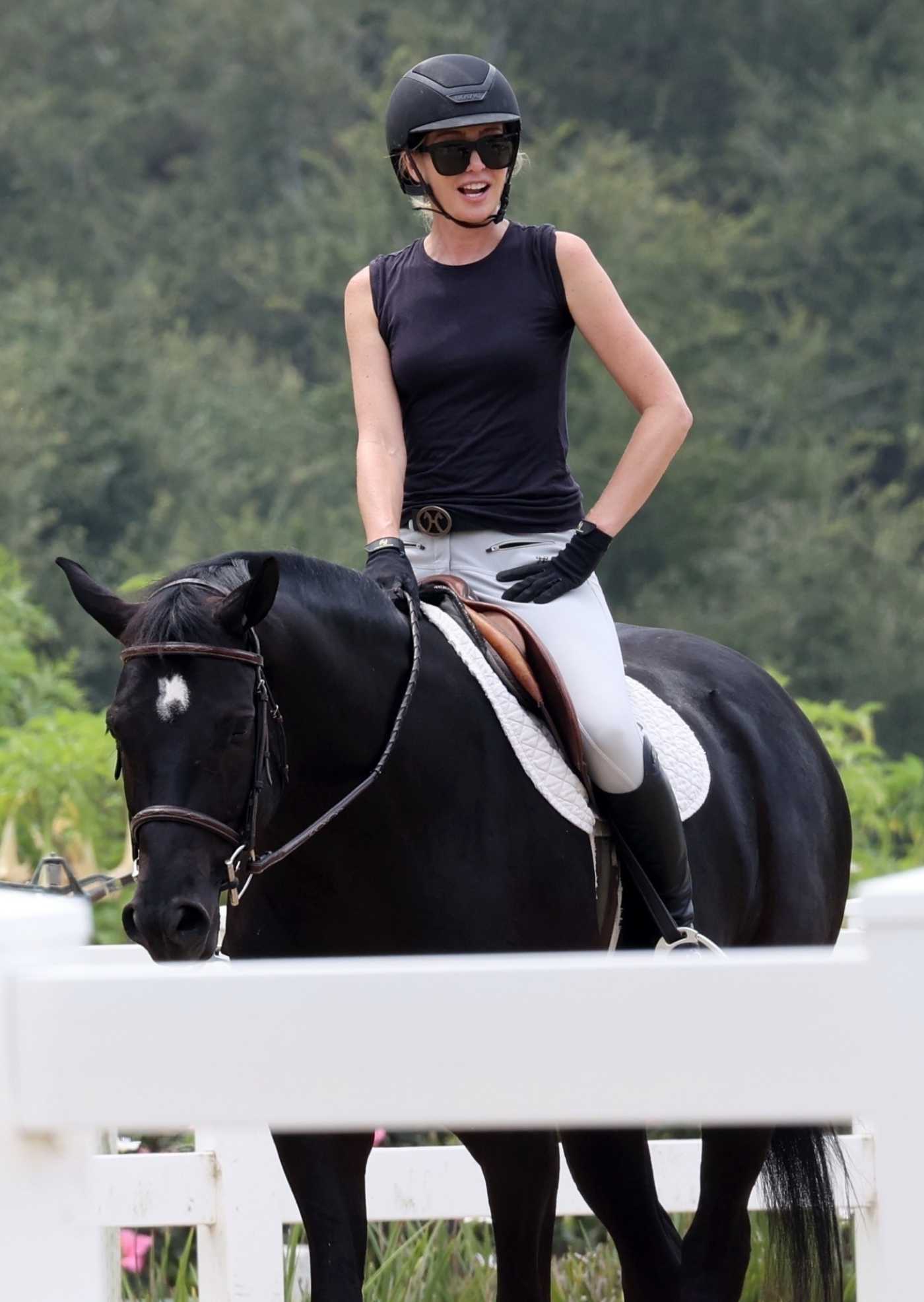Portia de Rossi in a Black Top Takes Horse Riding Lessons in Santa Barbara 08/23/2020