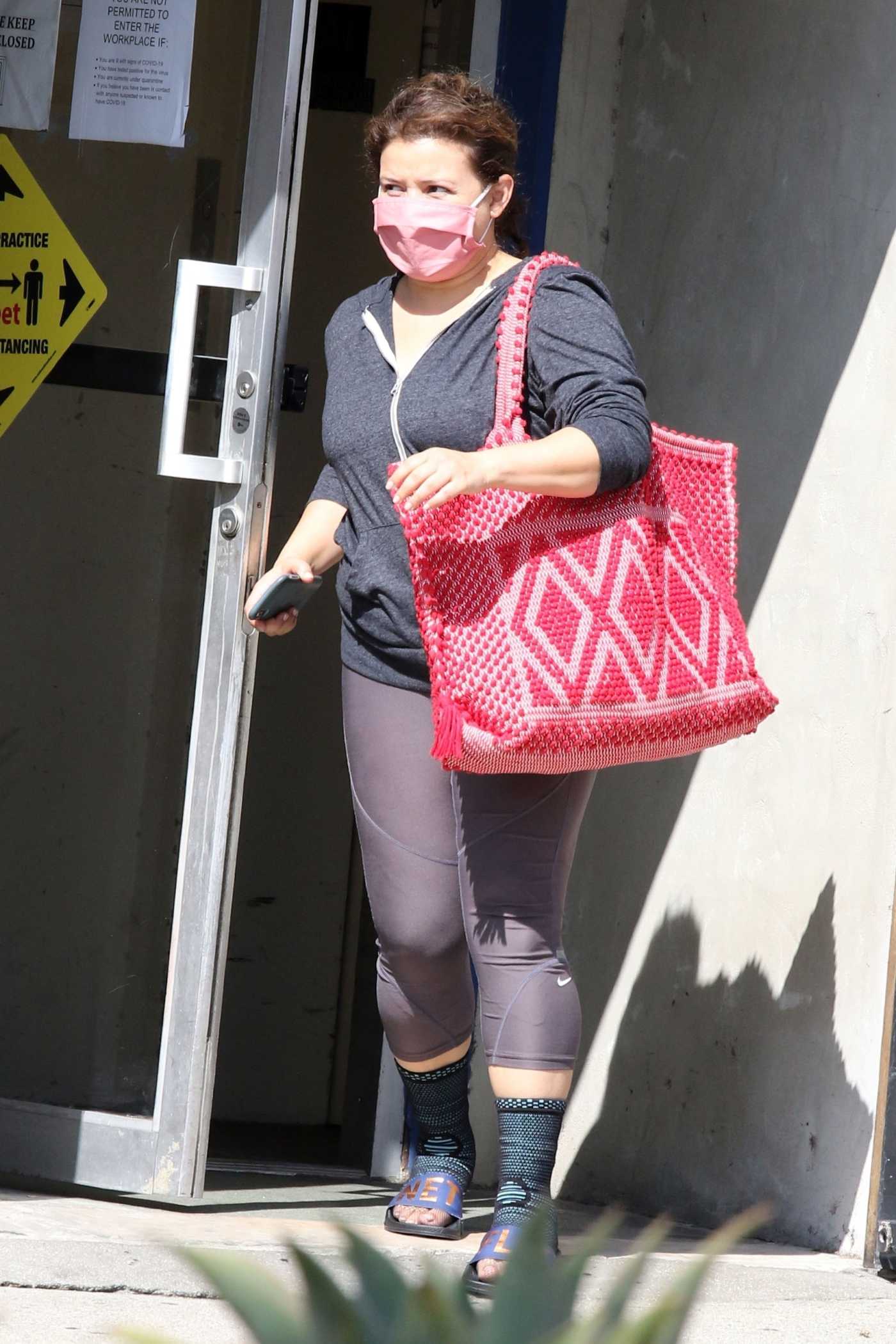 Justina Machado in a Protective Mask Heads Out of the DWST Studio in Los Angeles 09/20/2020