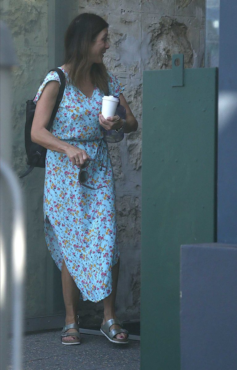 Kate Walsh in a Blue Floral Dress