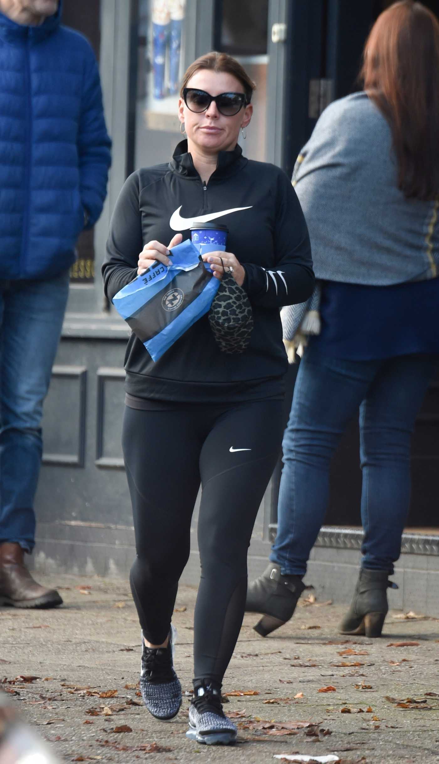 Coleen Rooney in a Beige Coat Loads up Boxes Out in ...