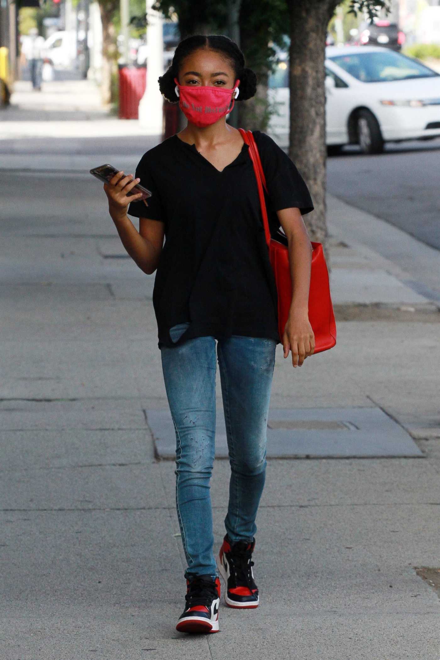 Skai Jackson in a Red Protective Mask Arrives at the DWTS Studio in Los Angeles 11/06/2020
