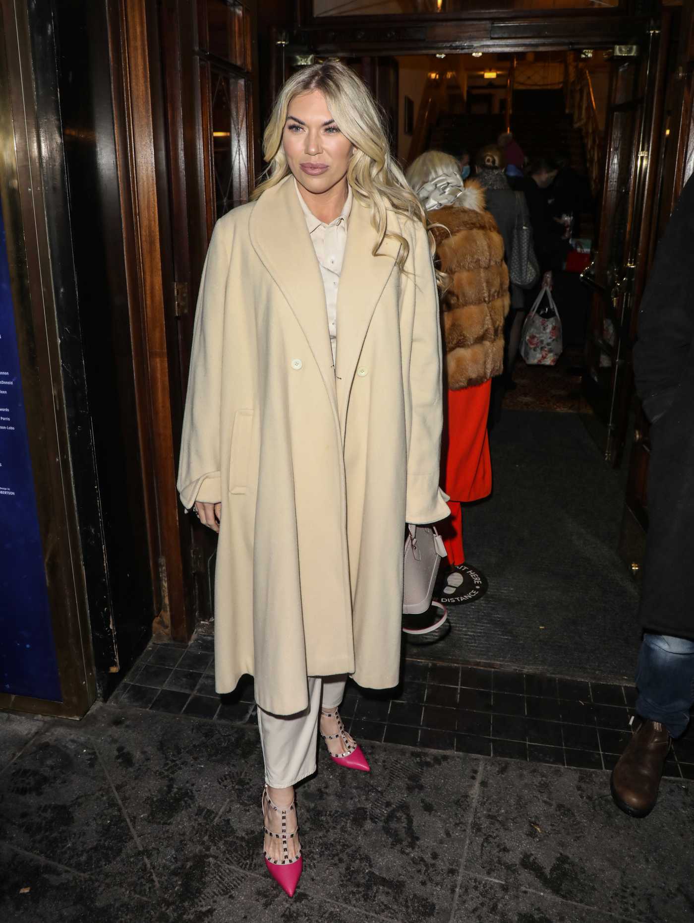 Frankie Essex in a Yellow Coat Arrives at the Press Night for A Christmas Carol at the Dominion Theatre in London 12/14/2020