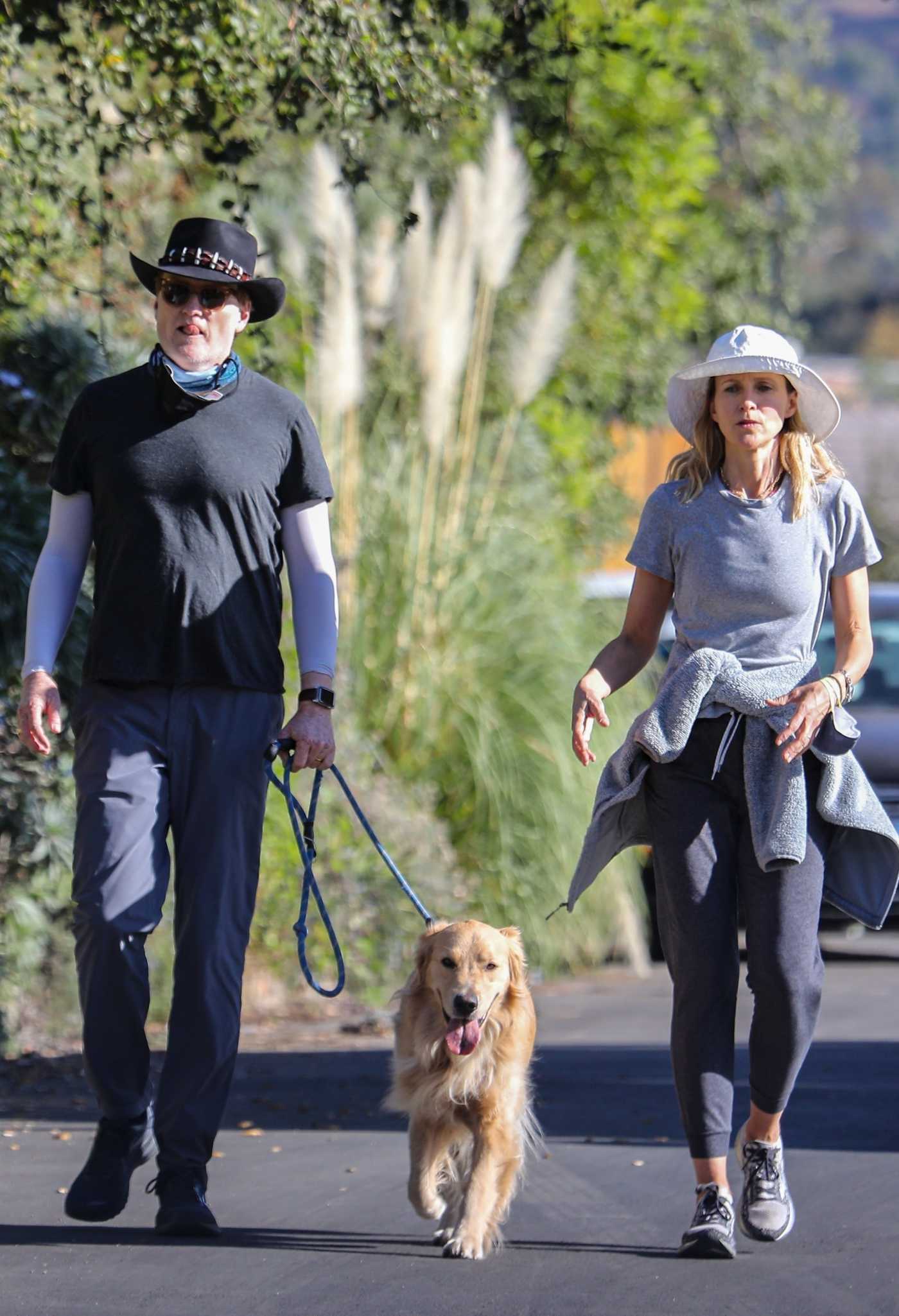 Liza Powel in a Grey Tee Walks Her Dog Out with Conan O'Brien in Brentwood 12/04/2020