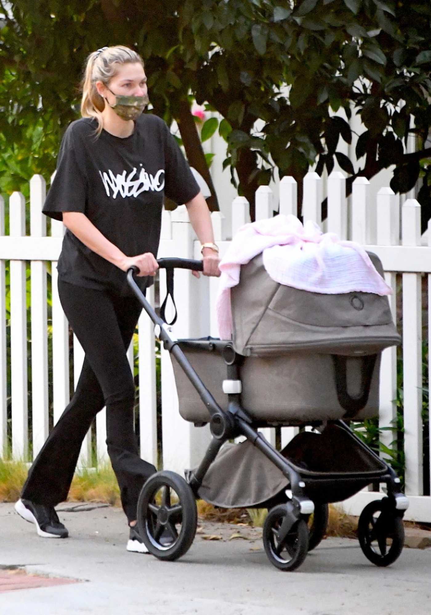 Jessica Hart in a Black Tee Steps Out for a Walk with Her Baby in Studio City 01/09/2021