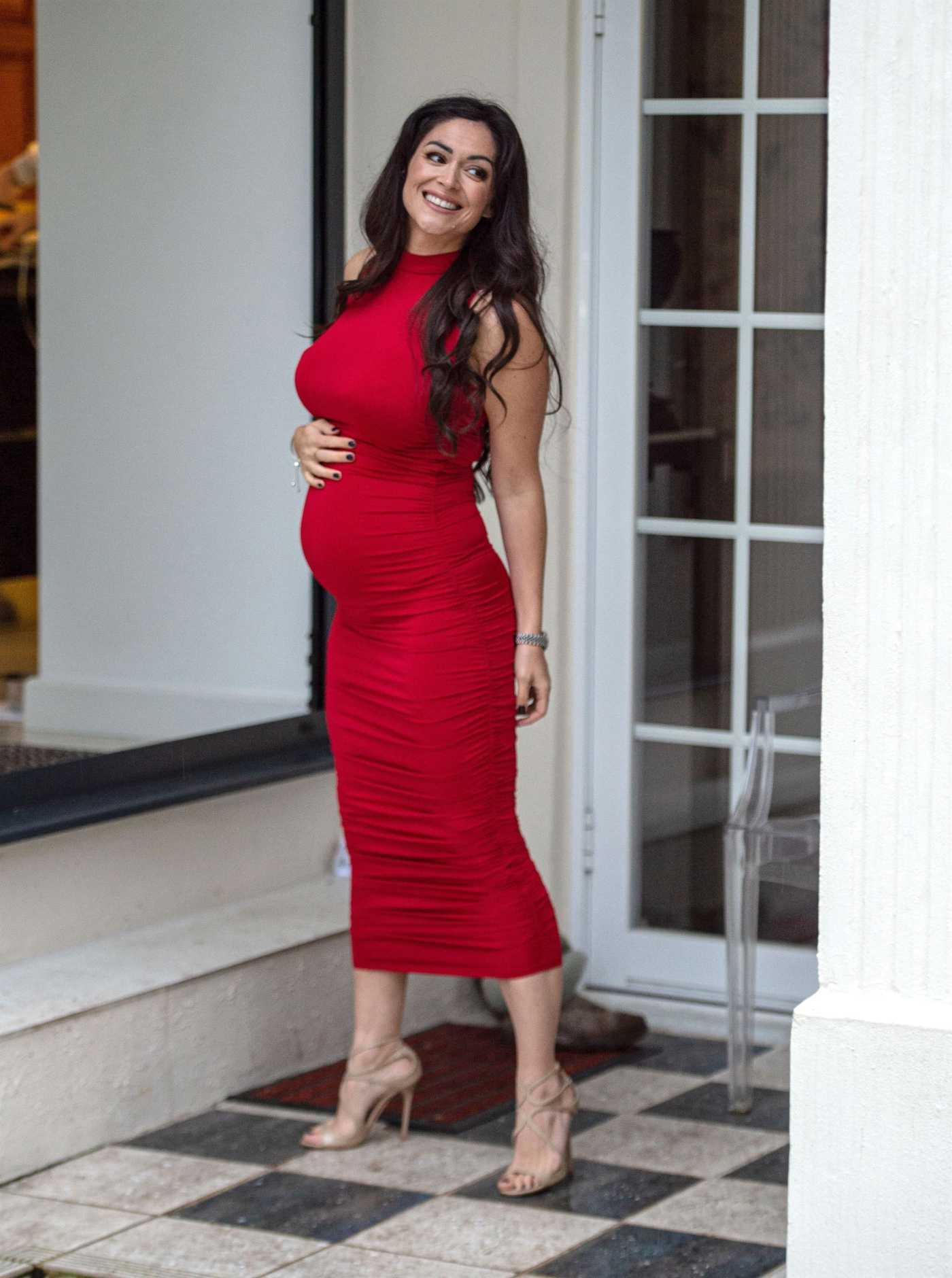 Casey Batchelor in a Red Dress Arrives at a Photoshoot in London 02/16/2021