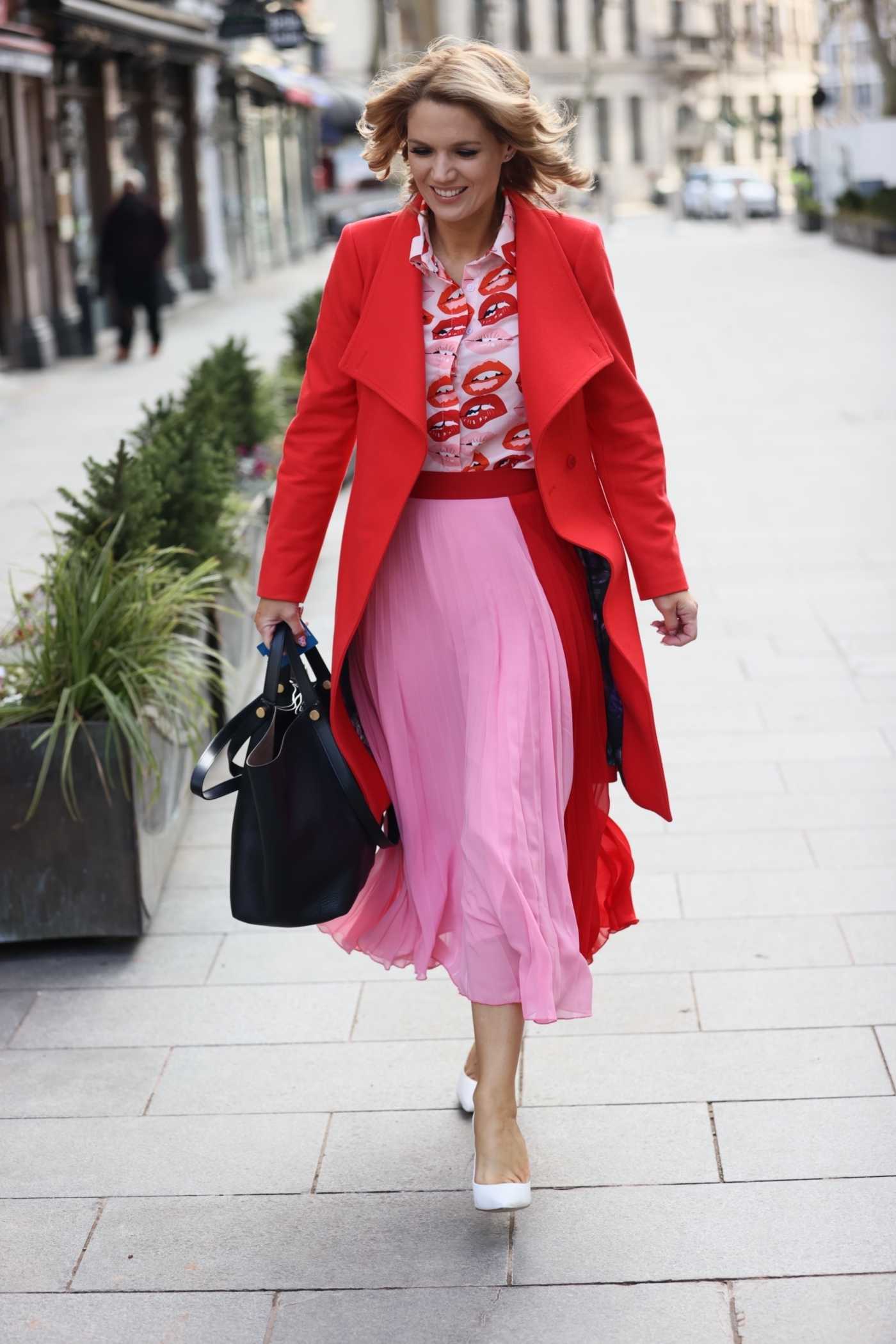 Charlotte Hawkins in a White Dress Leaves the Global Radio Studios in