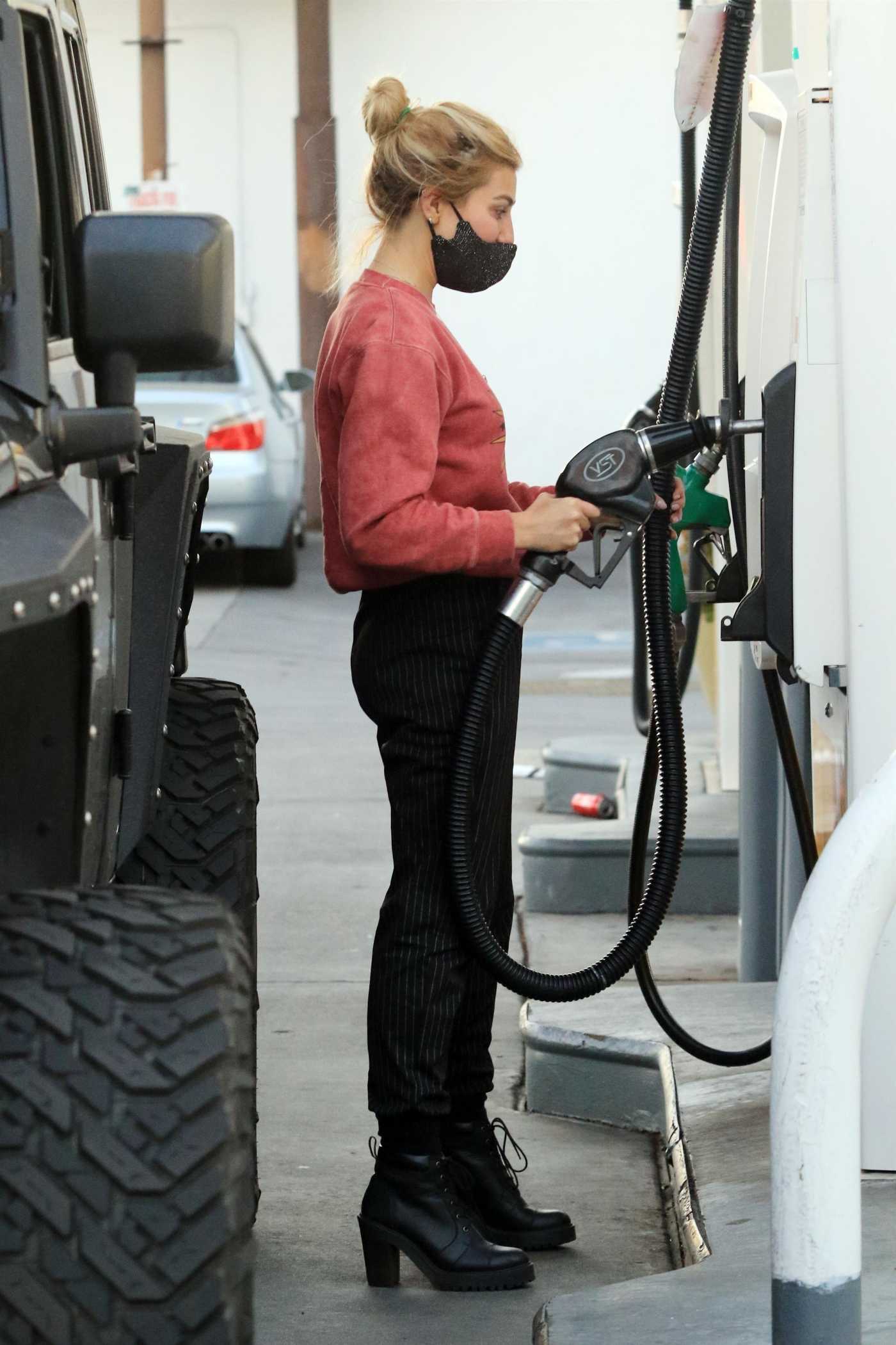 Emma Slater in a Red Sweatshirt Pump Gas in Her Beefy Jeep in Studio City 02/19/2021