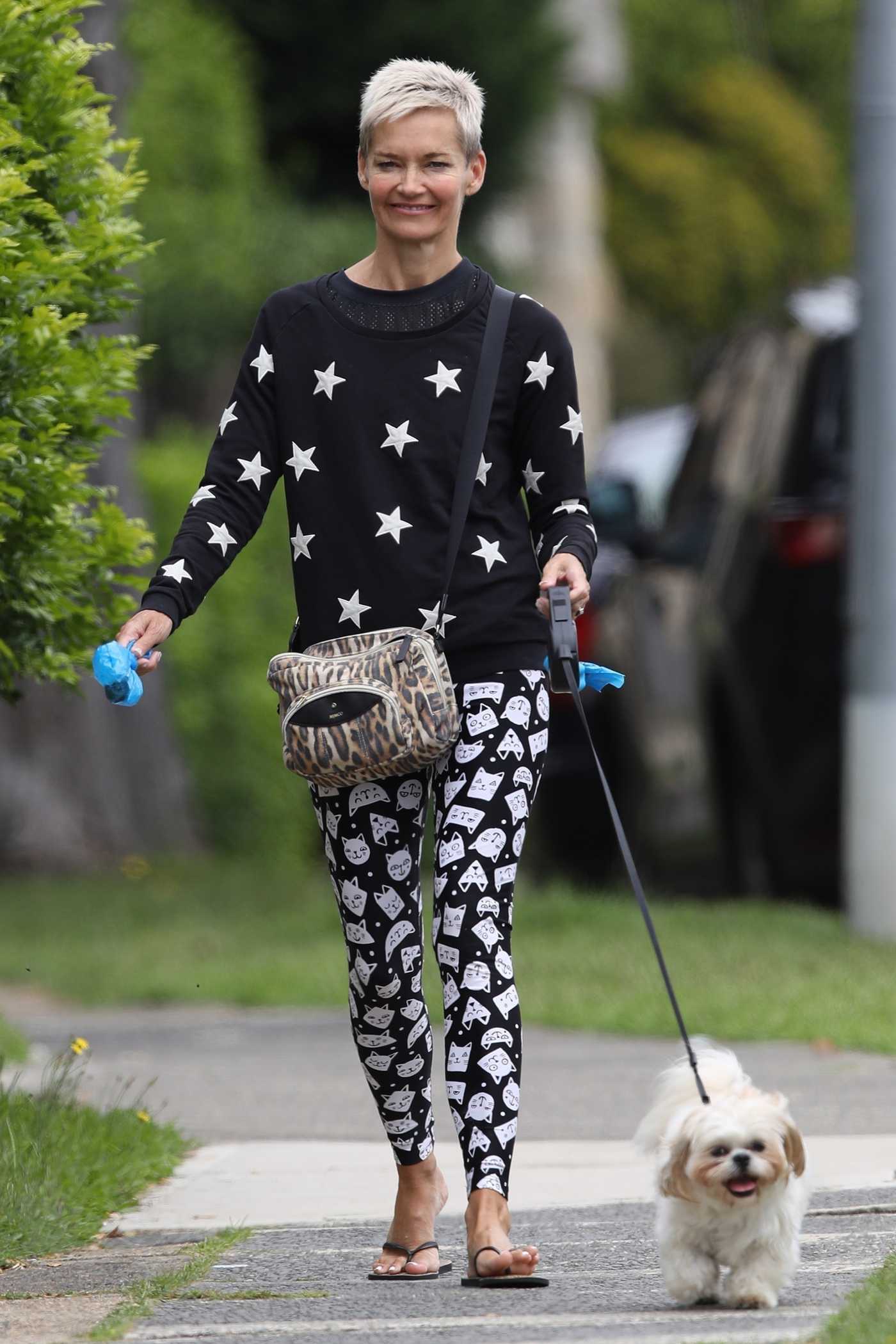 Jessica Rowe in a Cat Print Black Leggings Walks Her Dog in Sydney 02/09/2021