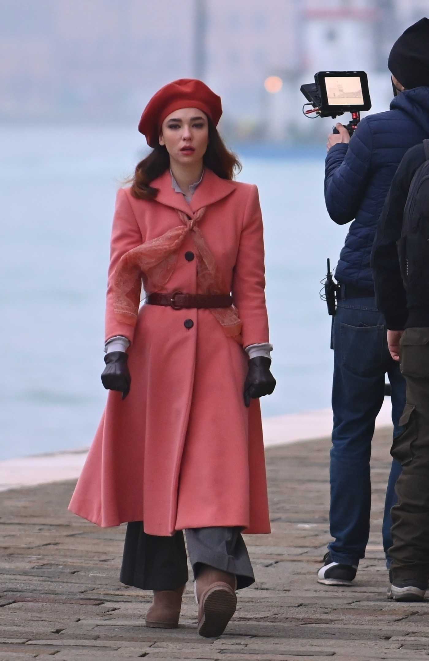 Matilda de Angelis in a Red Coat on Set Filming Across the River and Into the Trees in Venice 02/05/2021