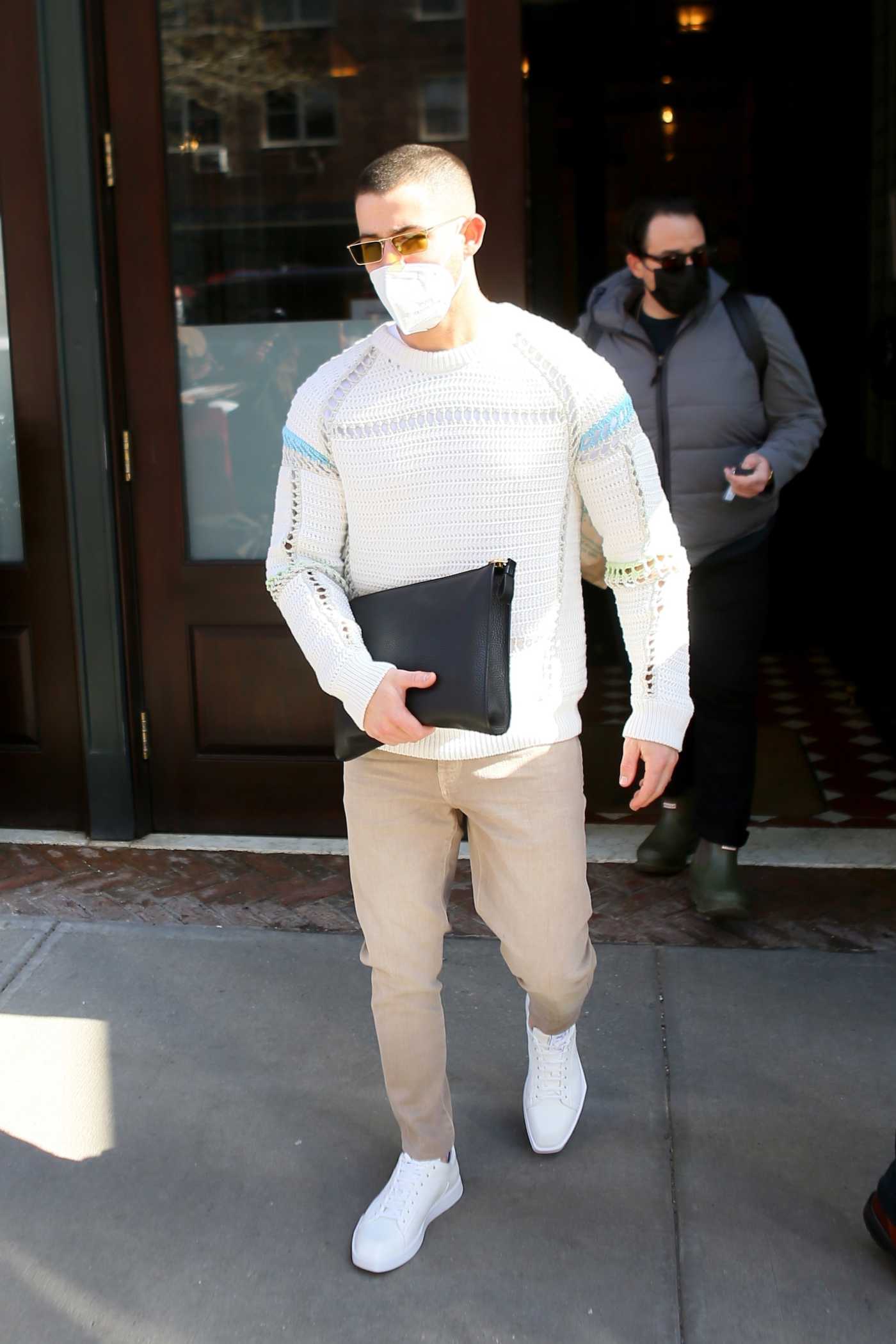 Nick Jonas in a White Sneakers Leaves His Hotel in New York 02/24/2021