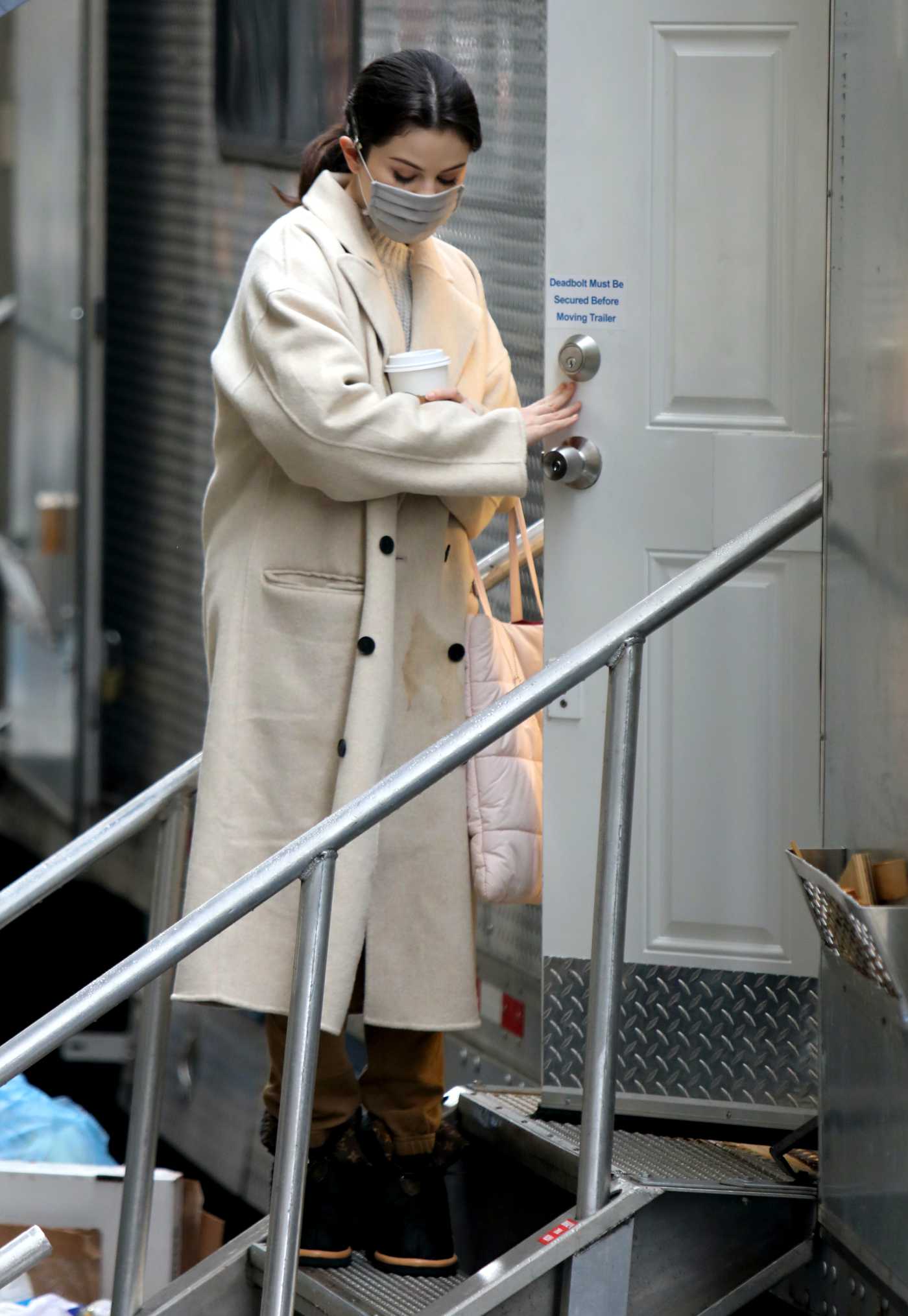 Selena Gomez in a White Coat on the Set of Only Murders in the Building in New York 02/09/2021