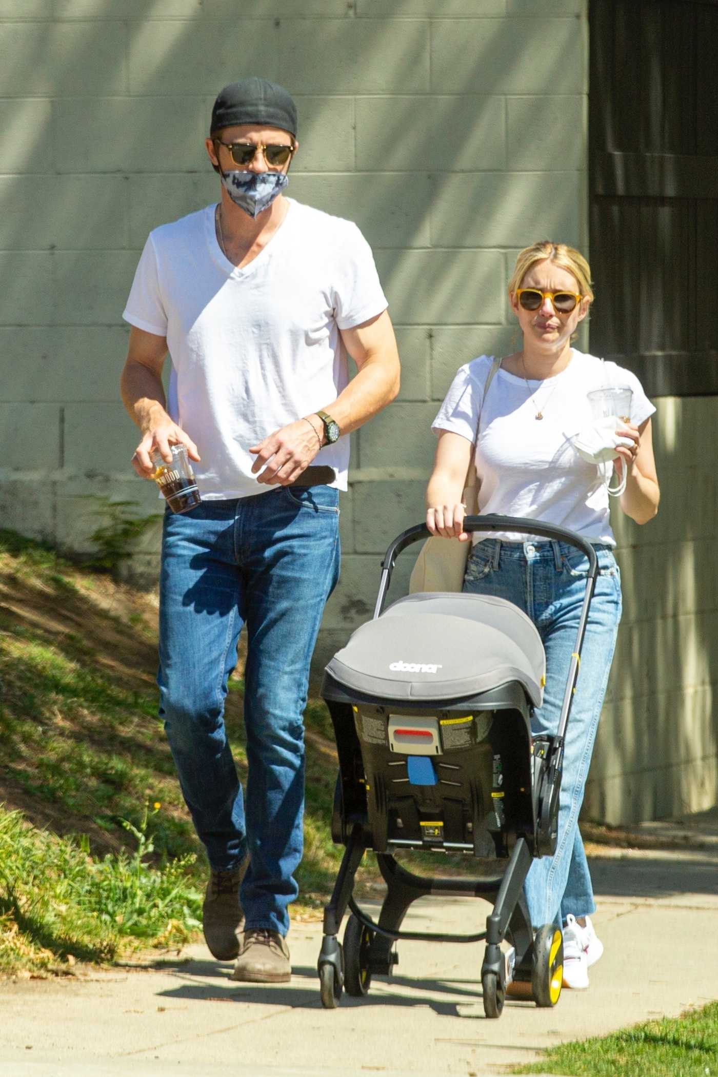 Emma Roberts in a White Tee Was Seen Out with Garret Hedlund and Their Baby in Hollywood 03/28/2021