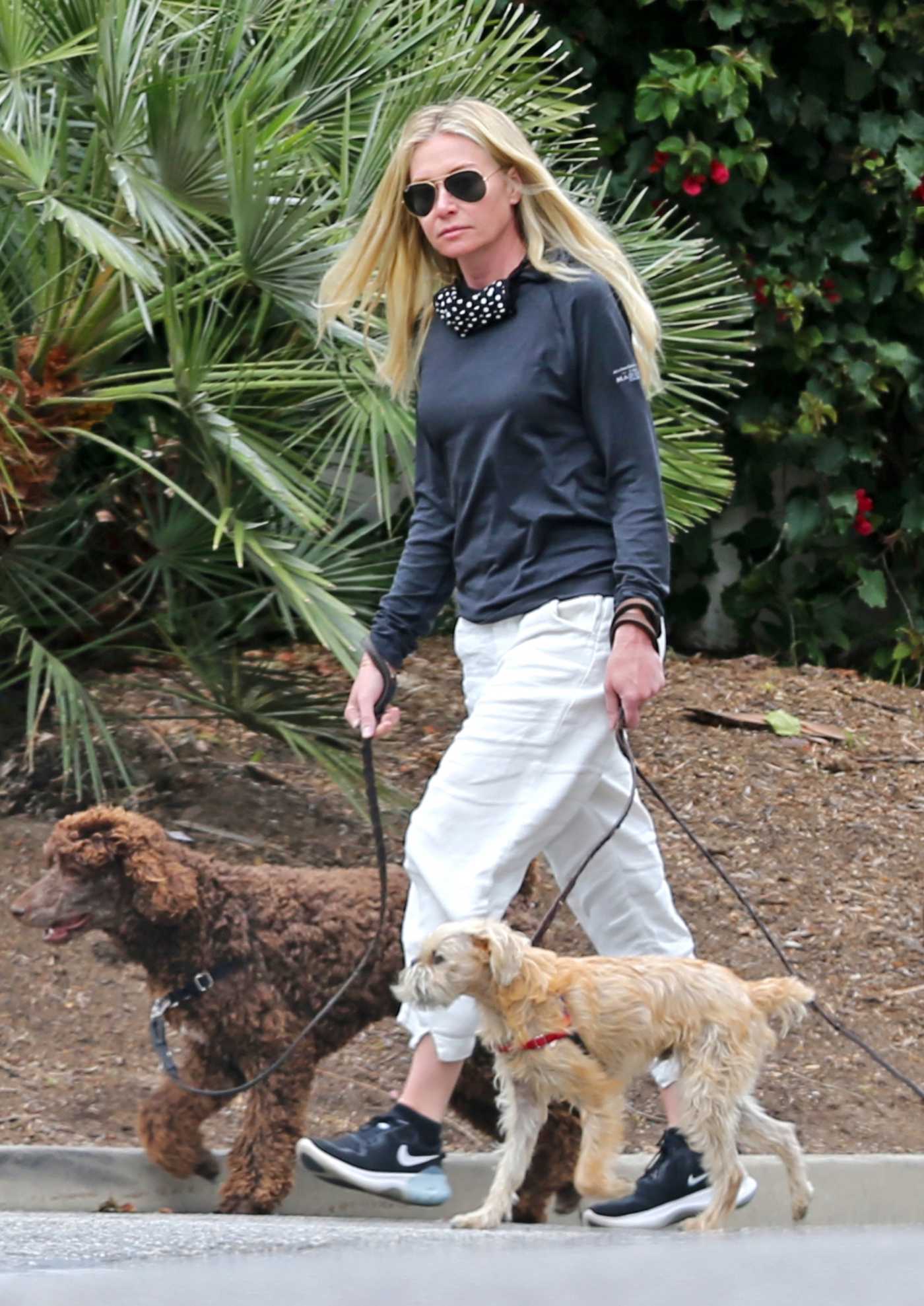 Portia De Rossi in a White Pants Walks Her Dogs in Montecito 03/14/2021