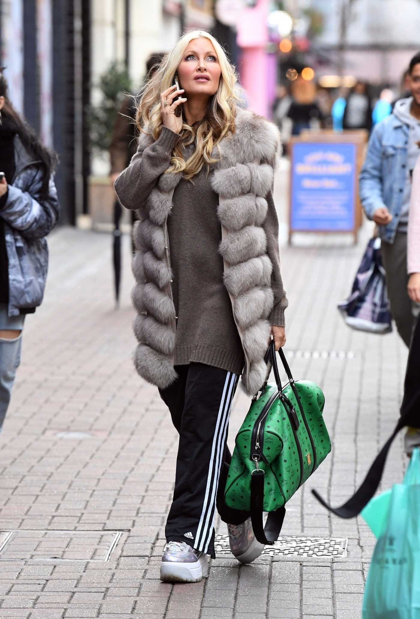 Caprice Bourret in a Black Adidas Track Pants Was Seen Out in London 04/12/2021