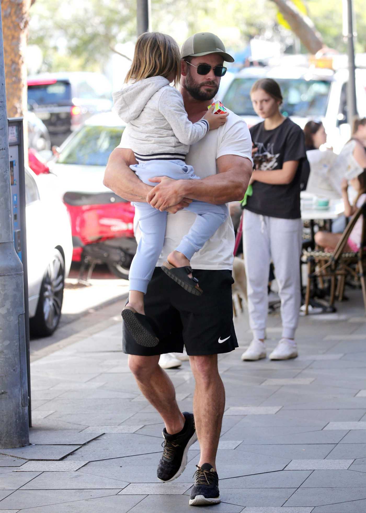 Chris Hemsworth in a White Tee Carries His Son to a Cafe in Sydney 04/15/2021