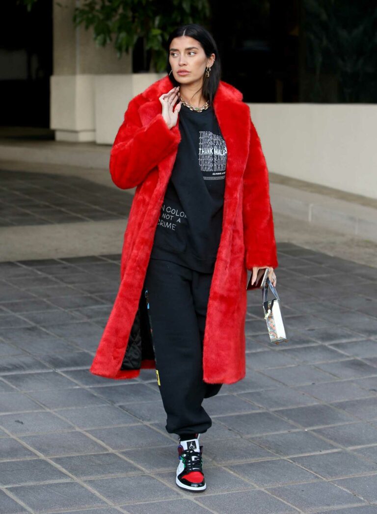 Nicole Williams in a Red Fur Coat