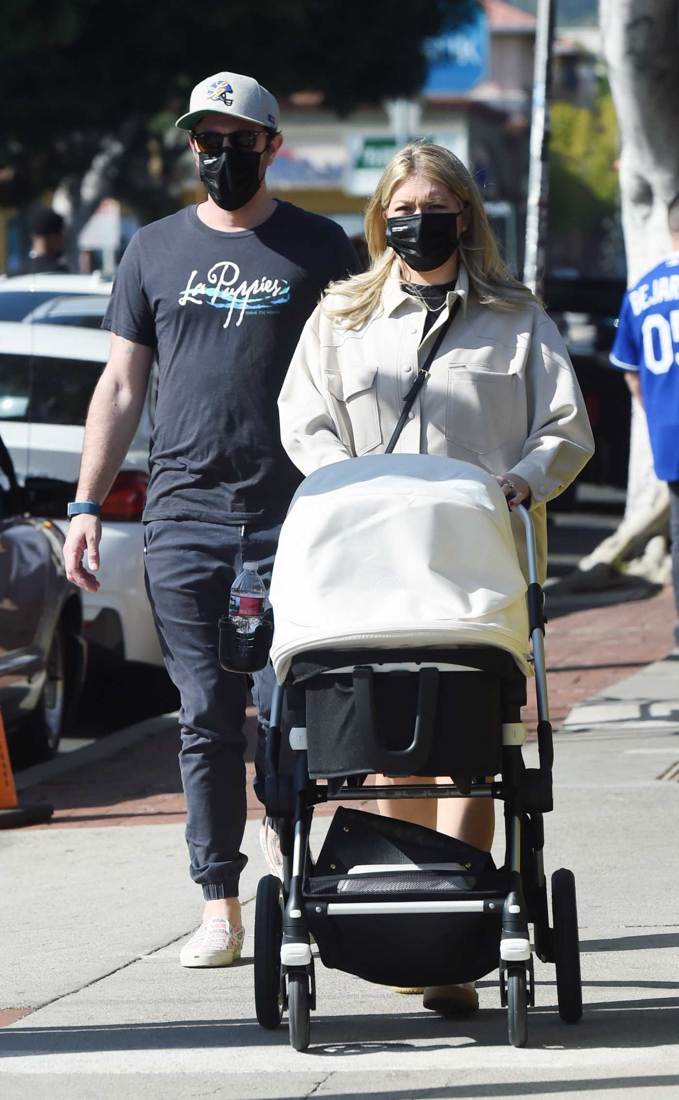 Stassi Schroeder in a Beige Shirt Was Spotted Out with Her Newborn Daughter and Beau Clark in Los Angeles 04/11/2021