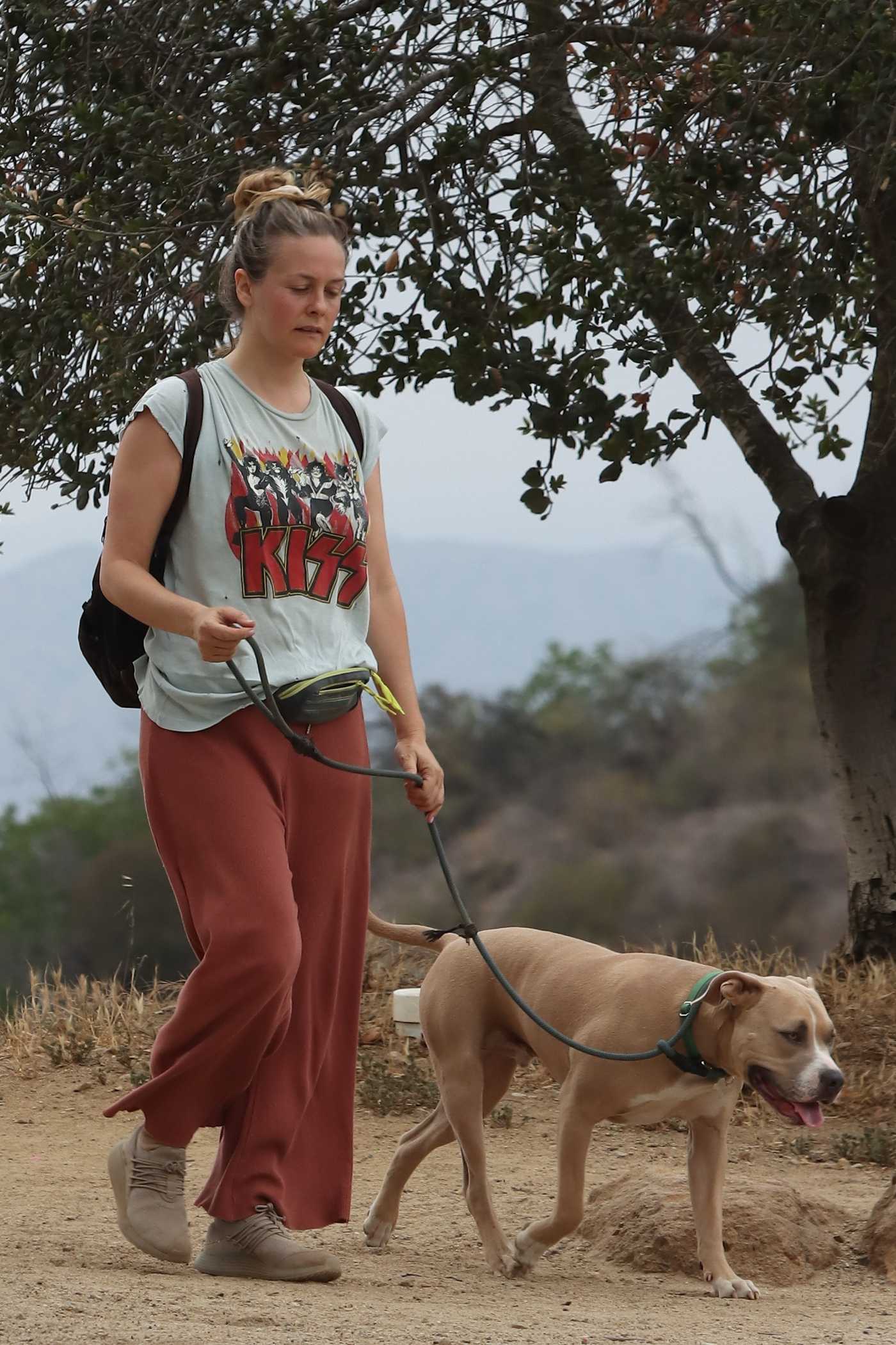 Alicia Silverstone in a KISS Tee Walks Her Dog in Hollywood 05/16/2021