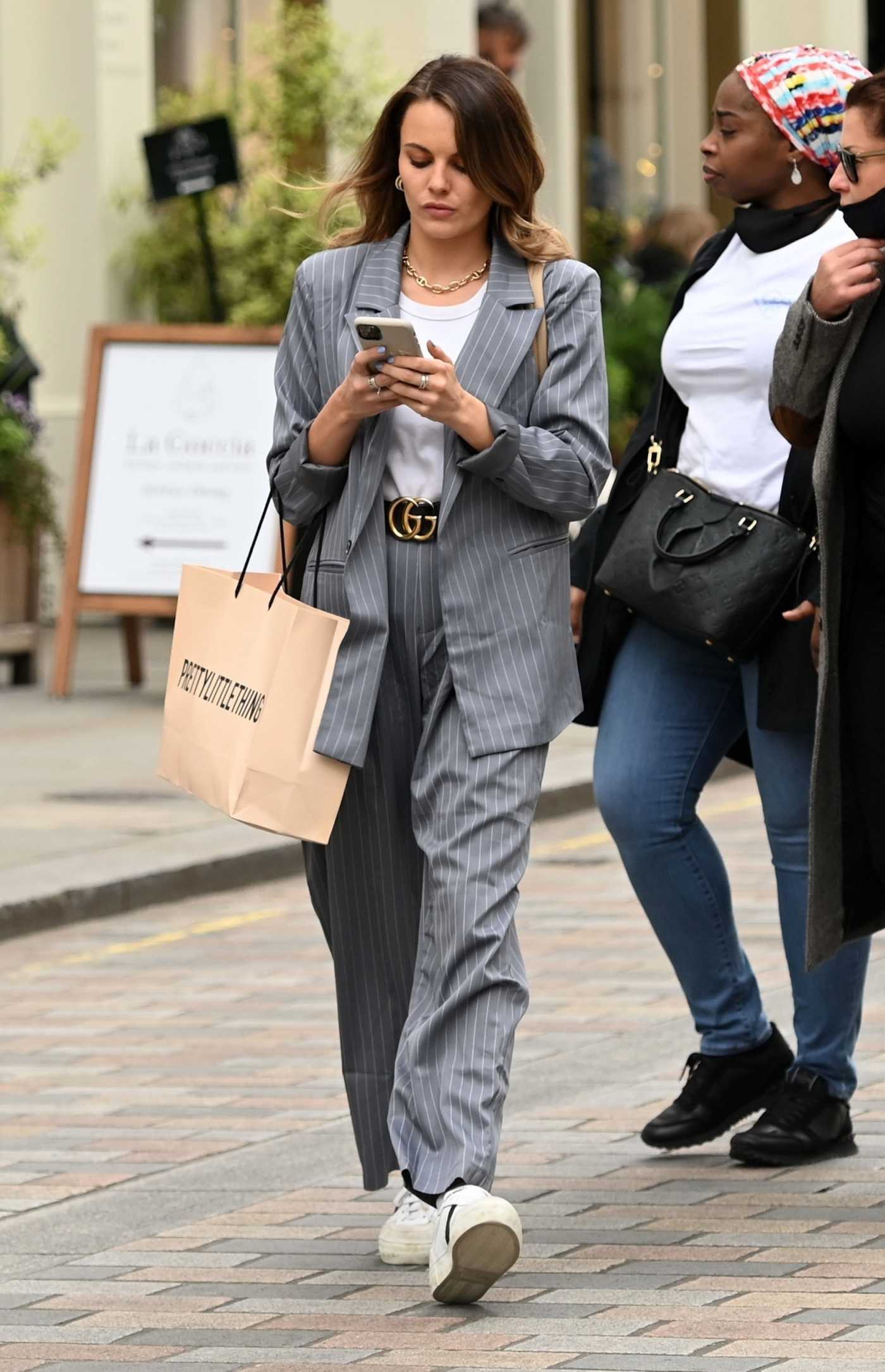 Emily Blackwell in a Grey Striped Suit Arrives at the Petersham Nurseries in Covent Garden in London
