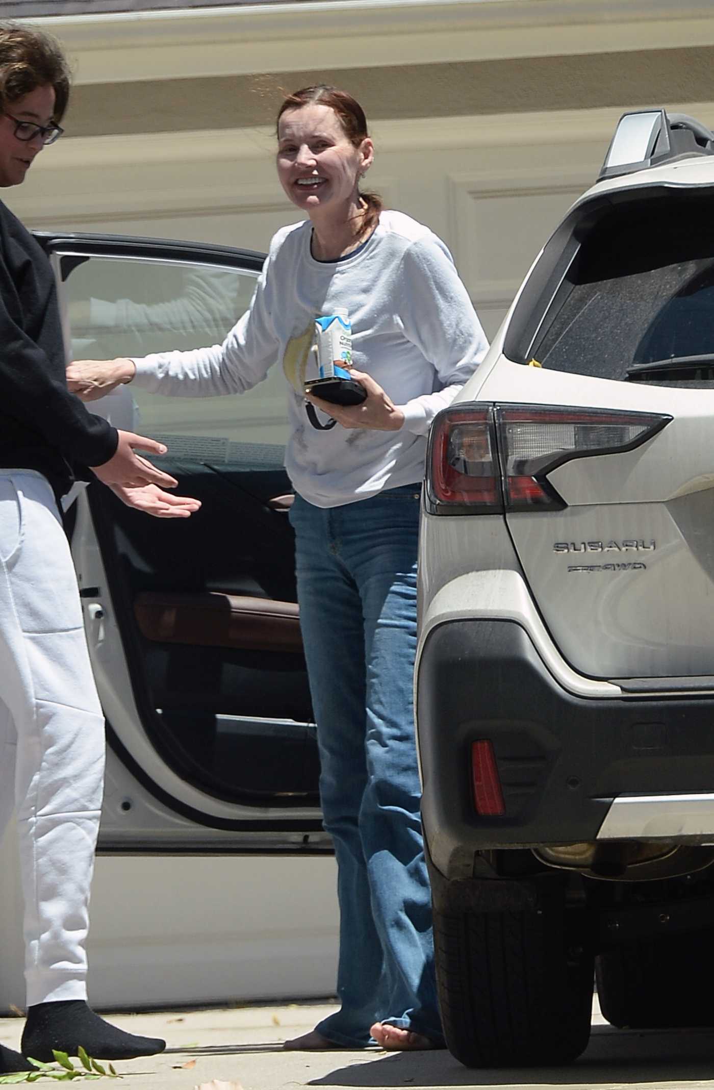 Geena Davis in a White Sweatshirt Chatting with a Friend in Los Angeles 05/24/2021