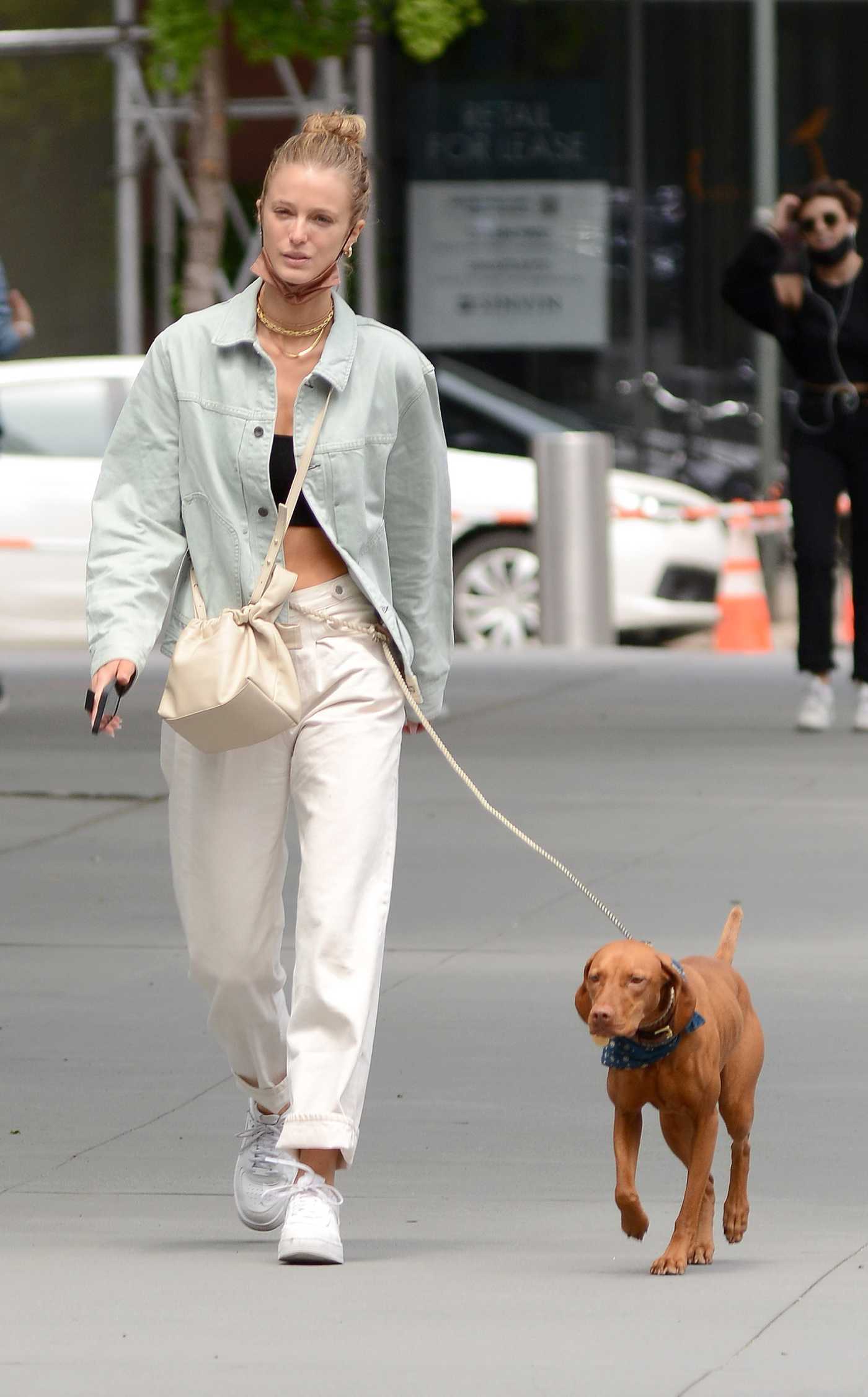 Kate Bock in a White Sneakers Walks Her Dog in New York 05/18/2021