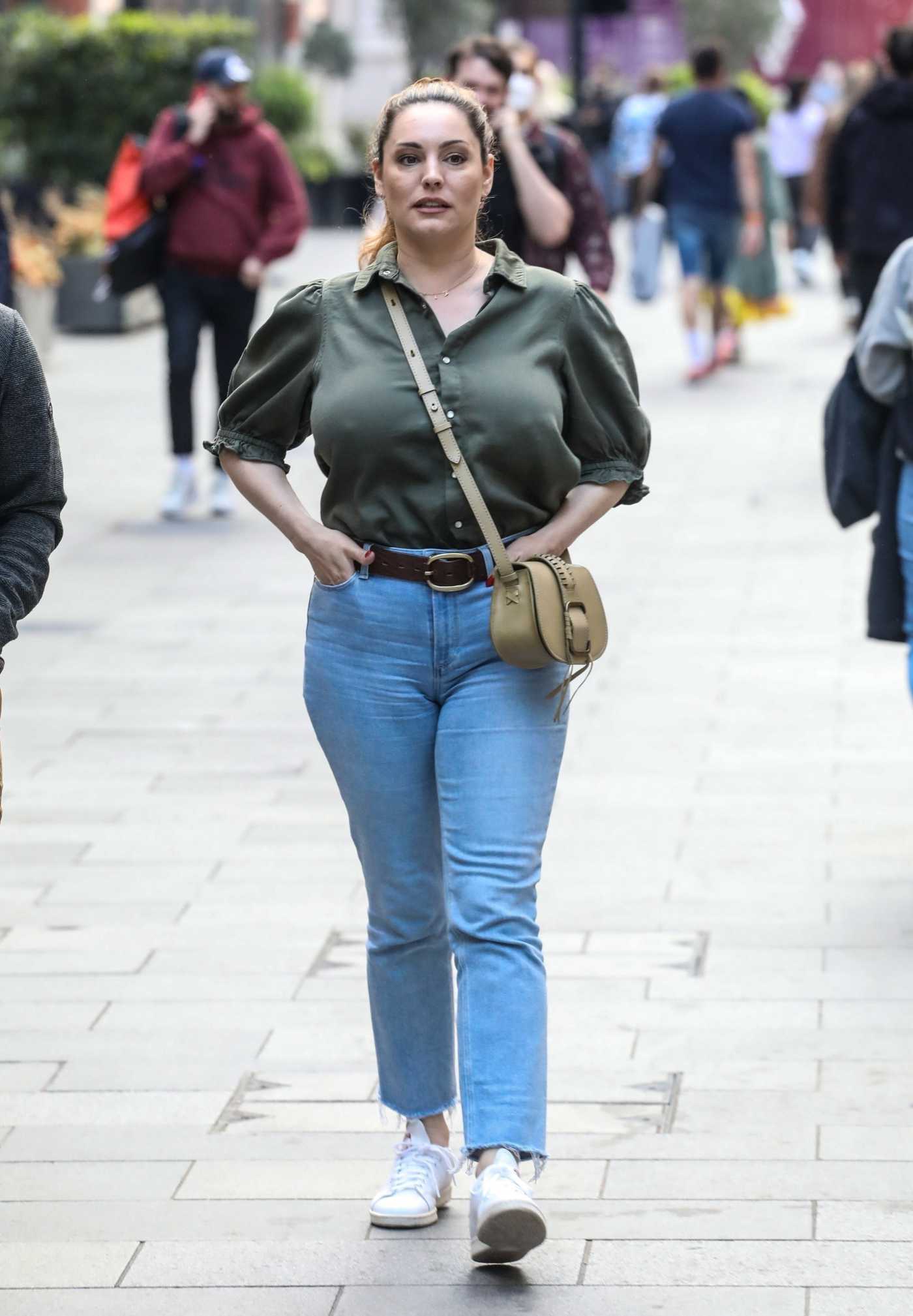 Kelly Brook in an Olive Blouse Leaves Her Heart FM Show at the Global Radio Studios in London 05/27/2021