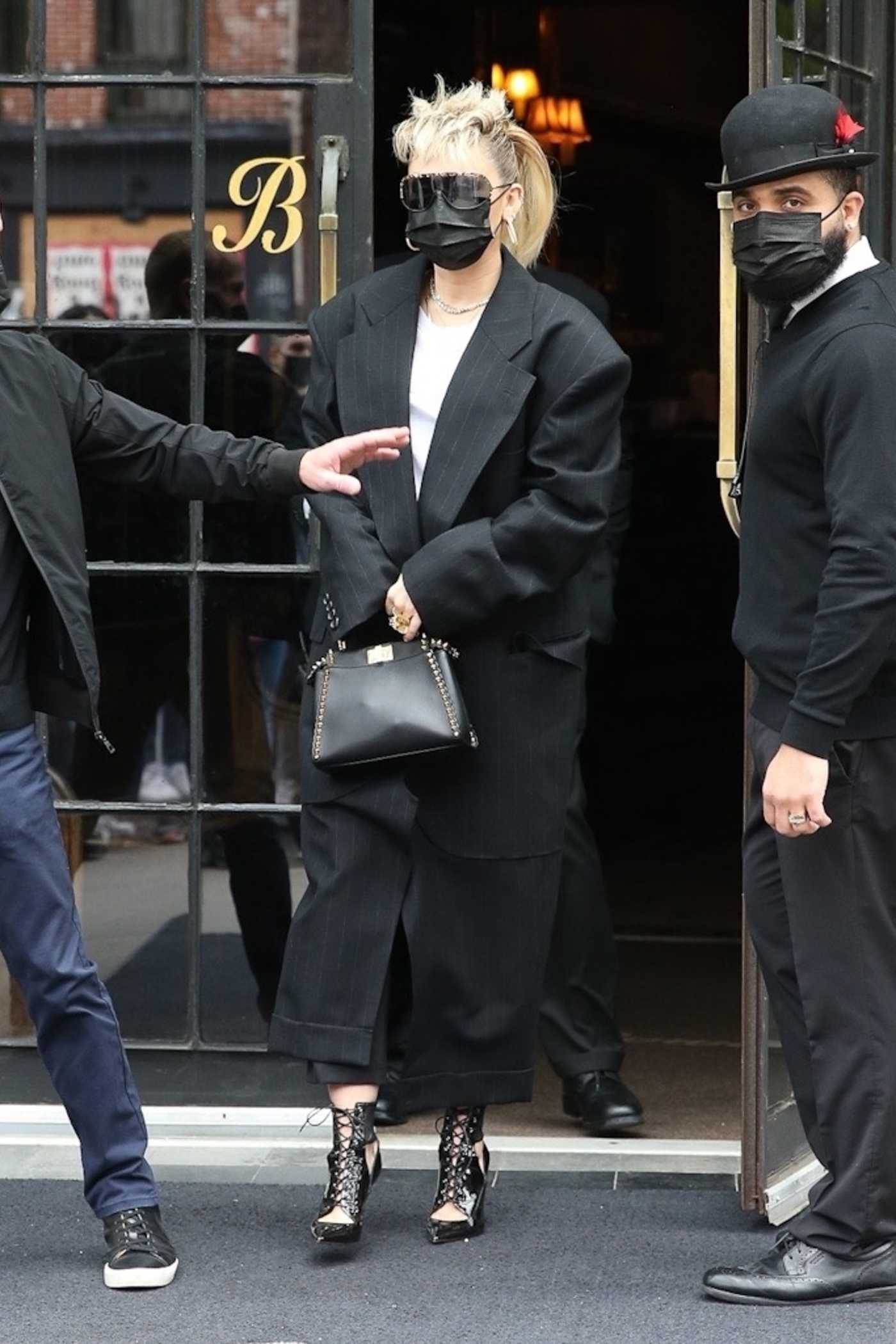 Miley Cyrus in a Black Suit Comes Out from the Bowery Hotel in New York 05/08/2021