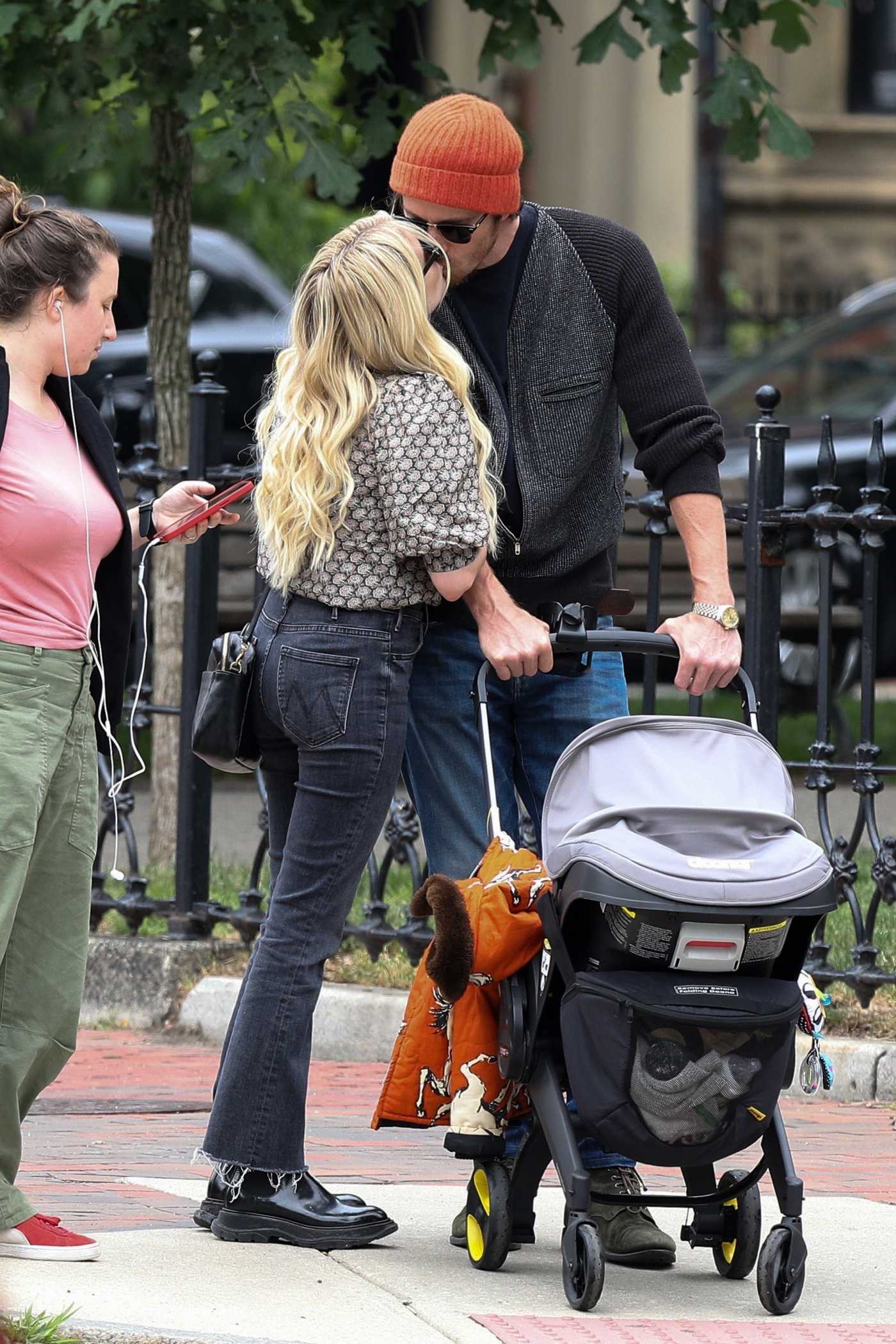 Emma Roberts in a Black Boots Goes Out for a Stroll with Garrett Hedlund and Their Baby in Boston 06/25/2021