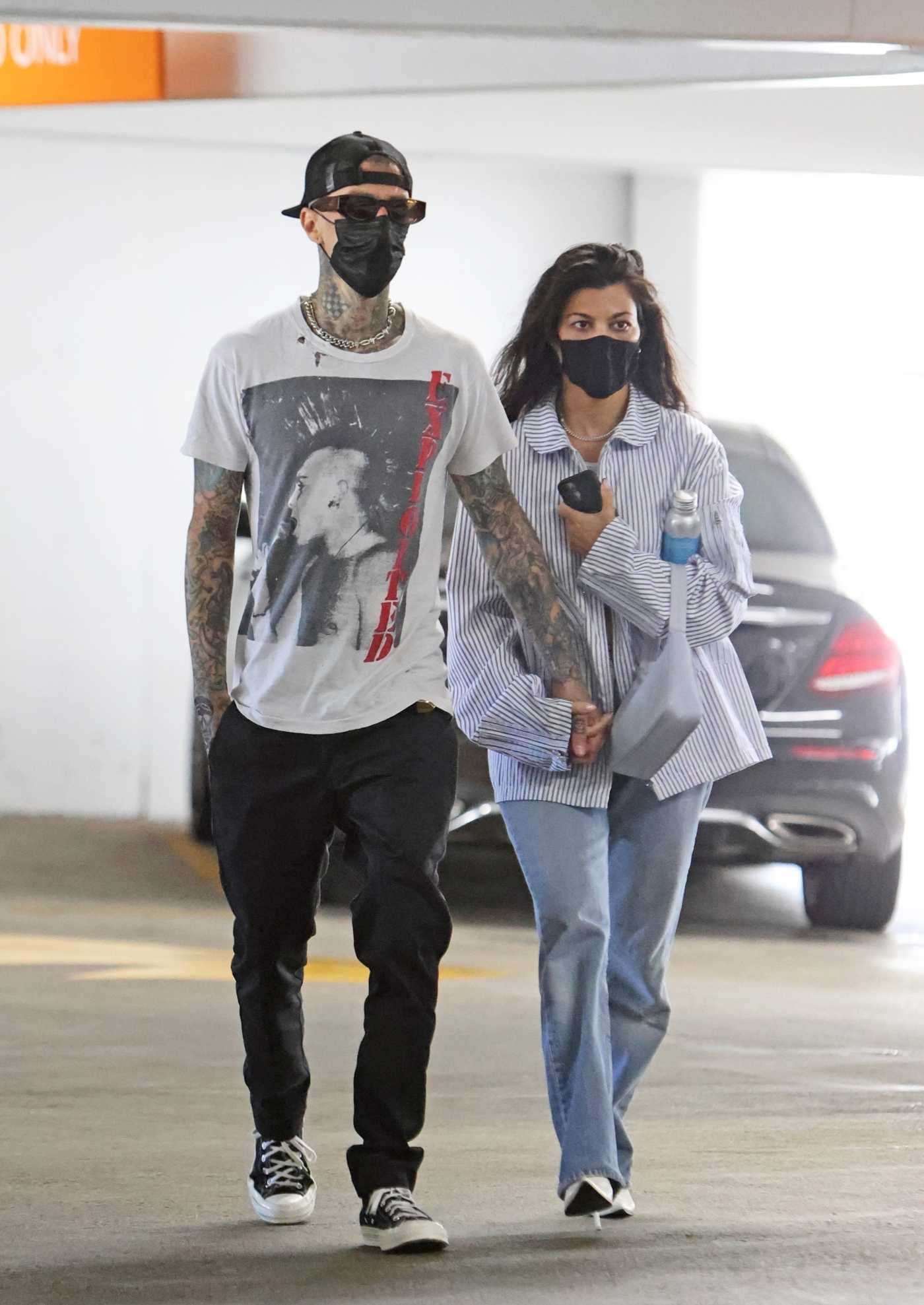 Kourtney Kardashian in a Striped Shirt Arrives at Cedars-Sinai Hospital Out with Travis Barker in Beverly Hills 06/02/2021