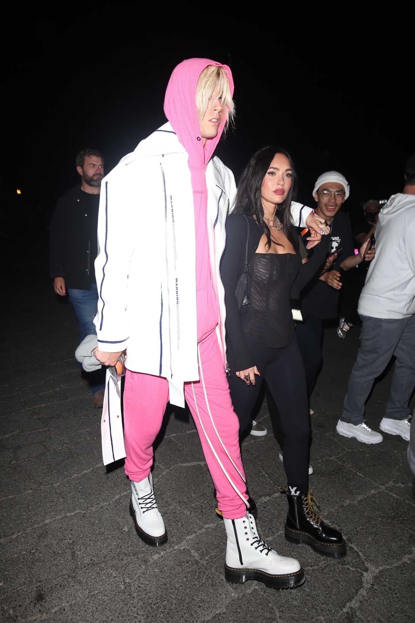 Machine Gun Kelly in a Pink Sweatsuit Arrives at Six Flags Magic Mountain Out with Megan Fox in Valencia 06/29/2021